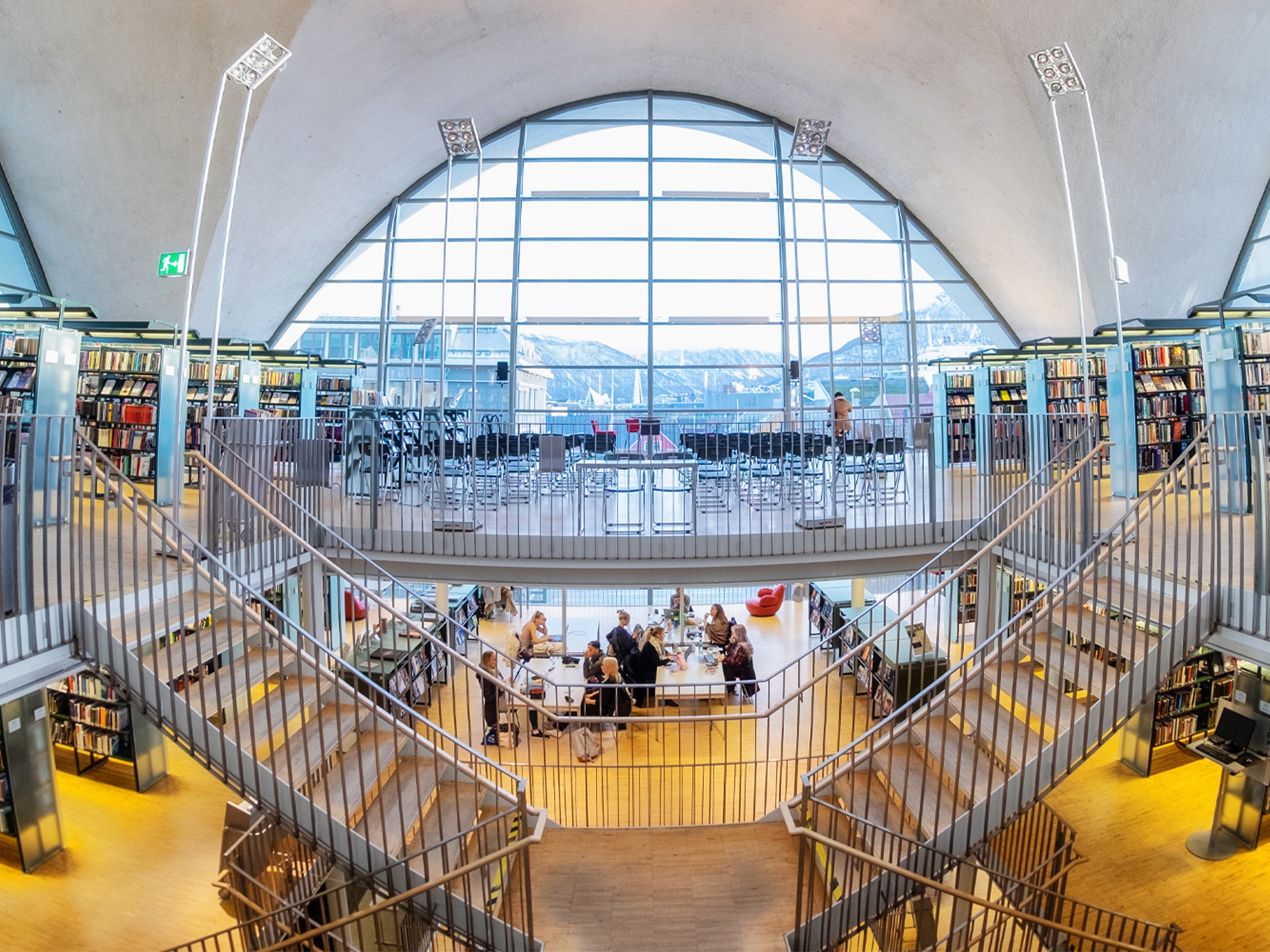 People reading Norwegian literature in Tromsø Library and City Archives