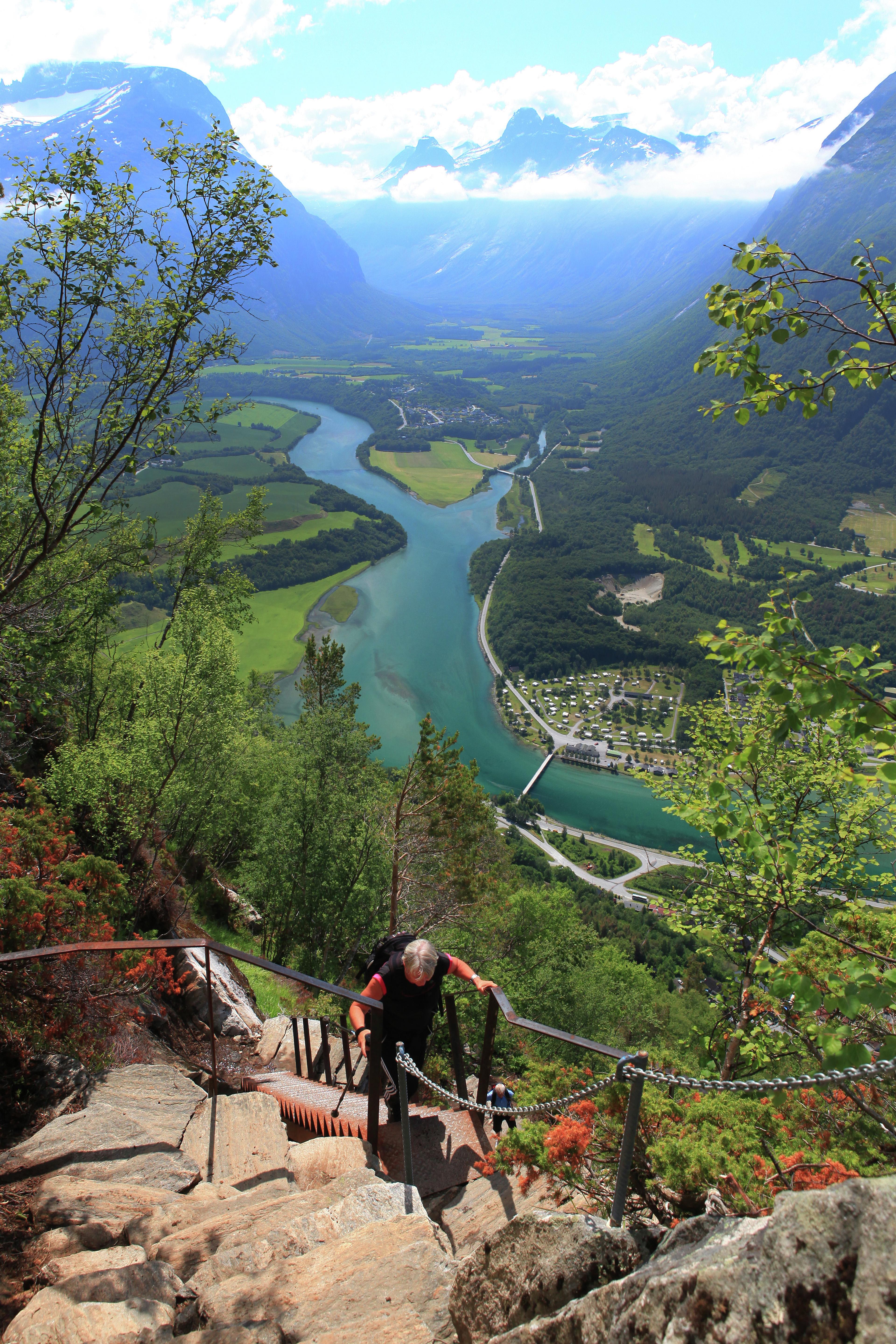 A man hiking the Romsdalstrappa stairs in Åndalsnes, Norway