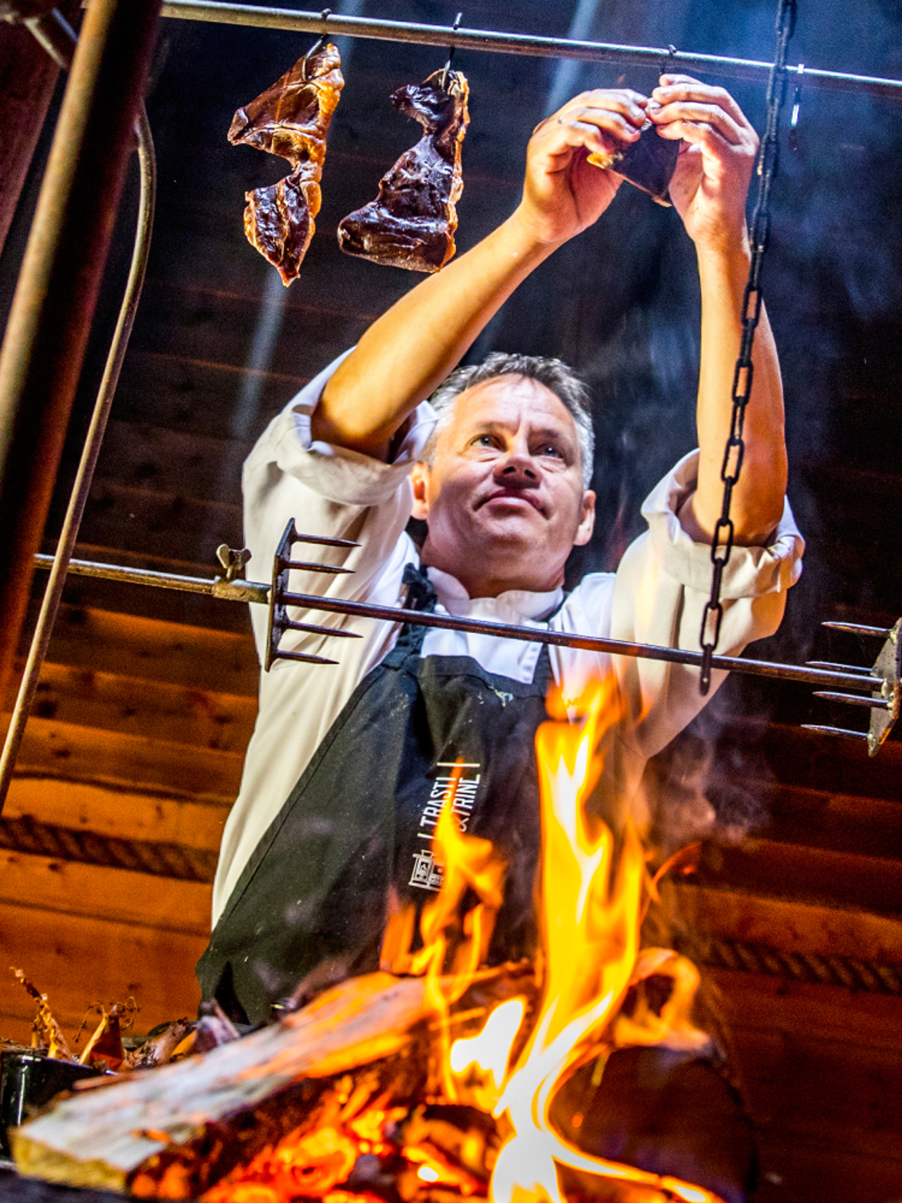 Johnny Trasti cooking over a bonfire