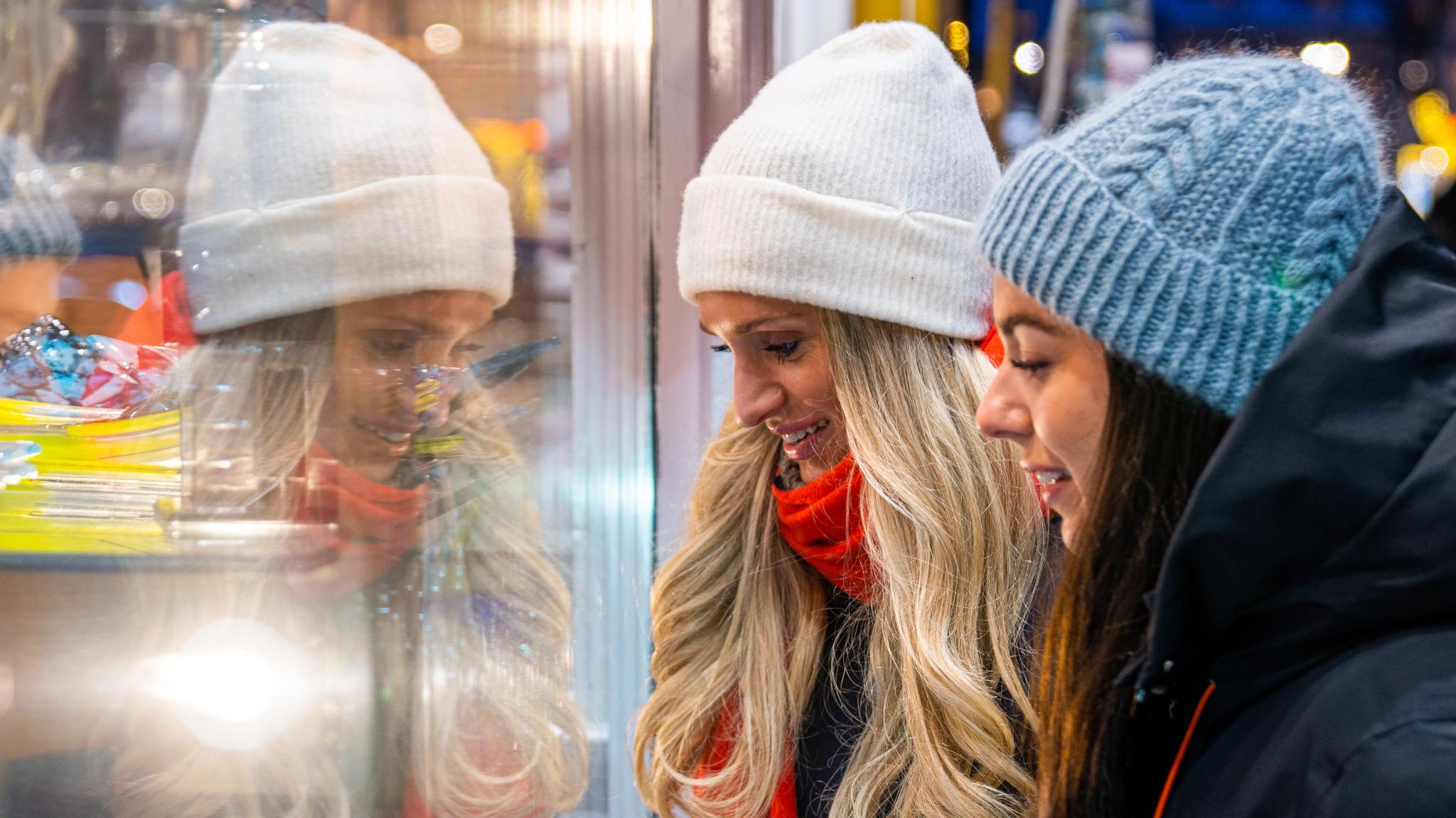 Two girls Christmas window shopping in Tromsø
