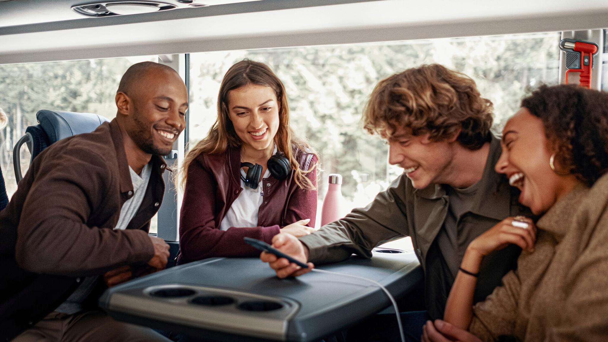 A group of friends traveling by bus in Norway.