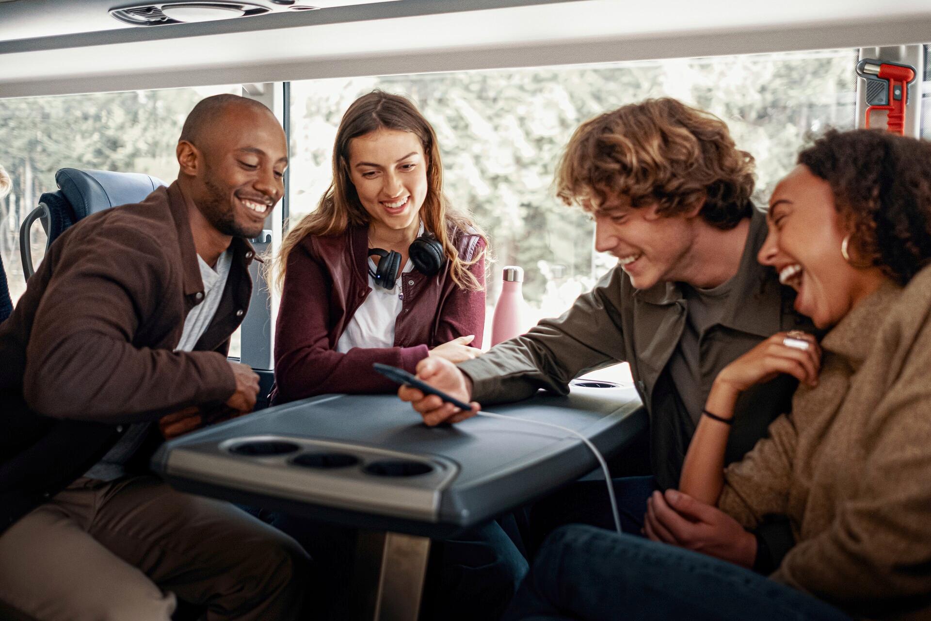A group of friends traveling by bus in Norway.