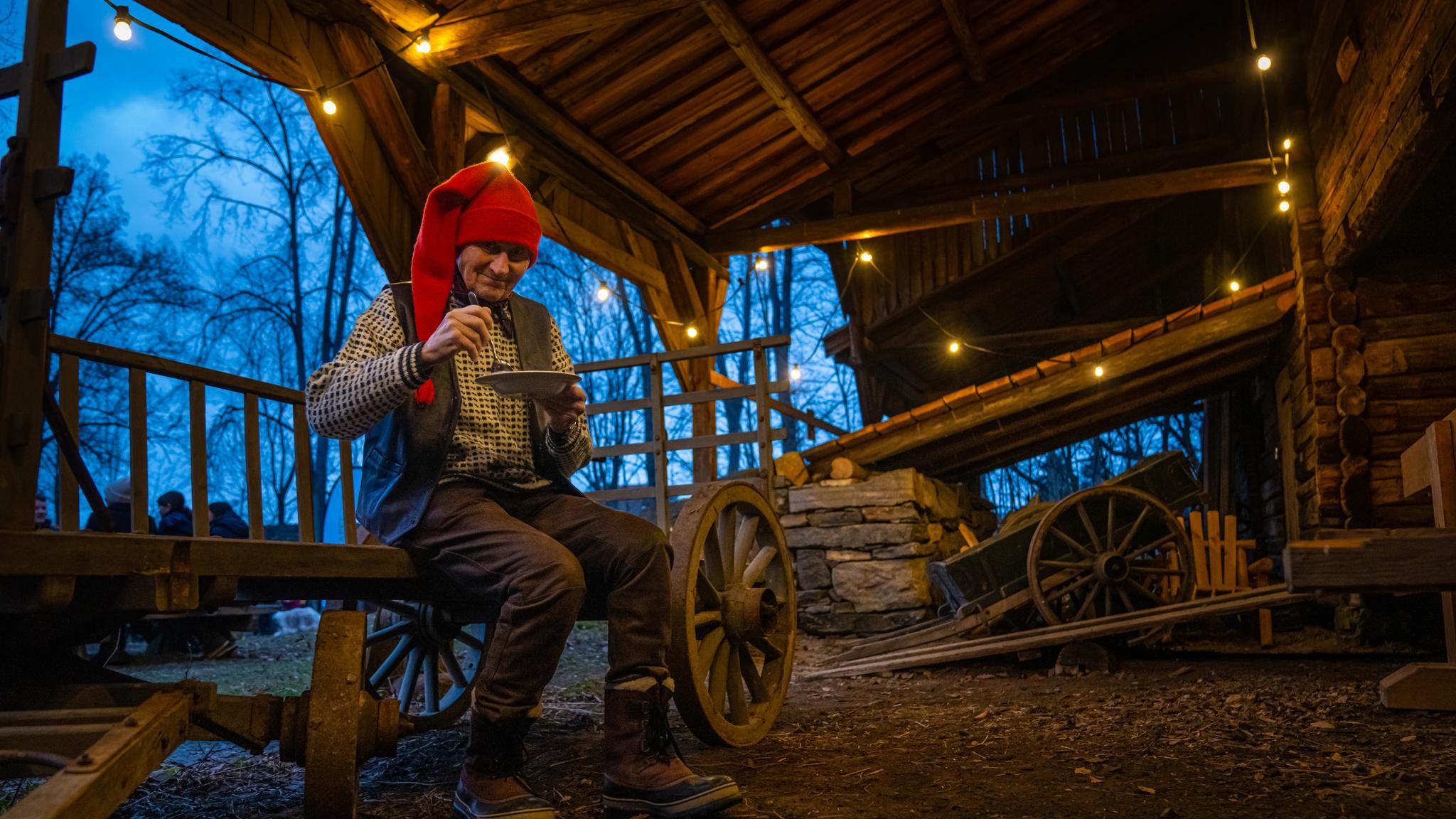The Norwegian Santa is eating porridge at the Christmas market in Norsk Folkemuseum in Bygdøy, Eastern Norway