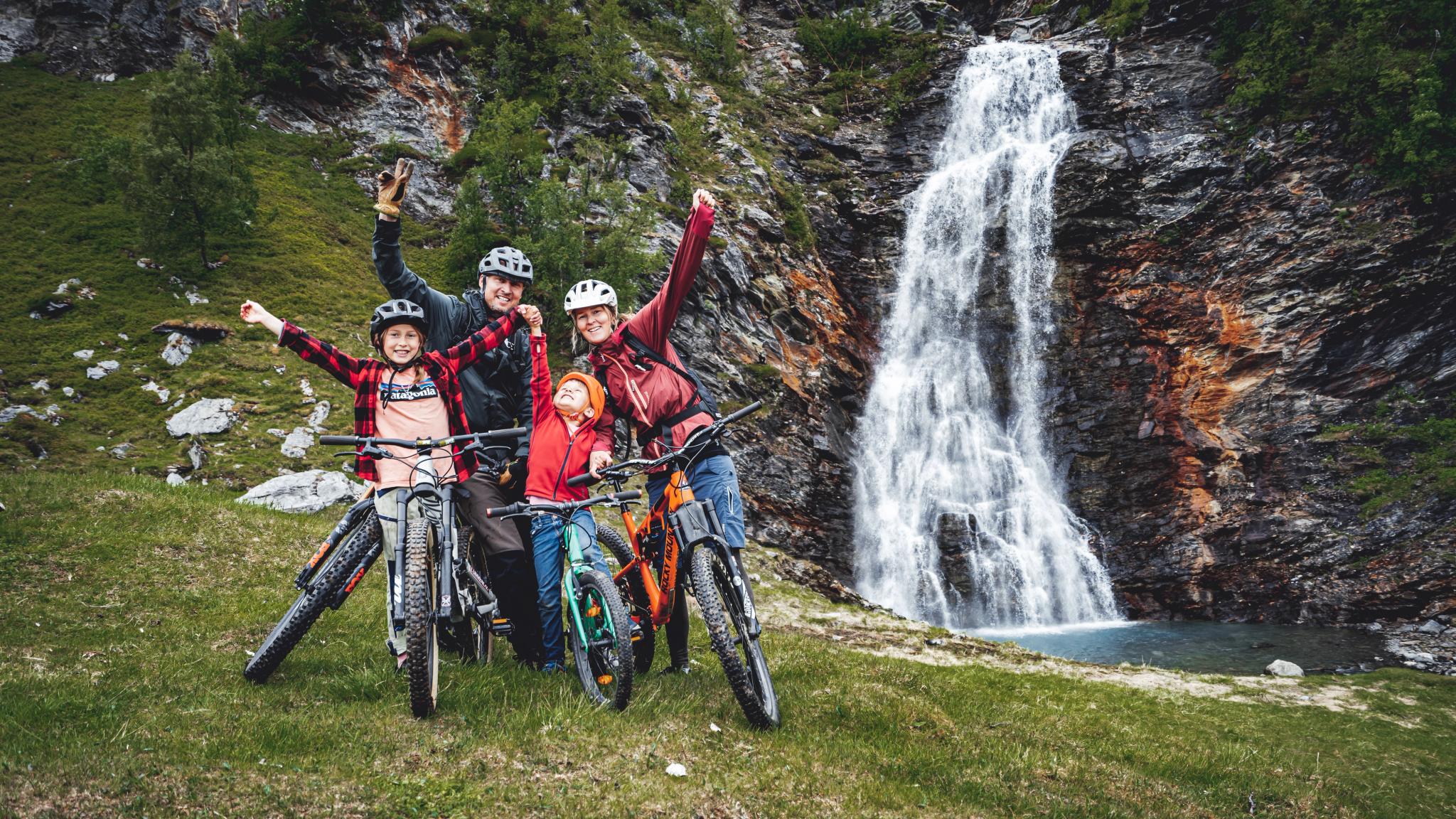 Family biking by the Rottenvik waterfall