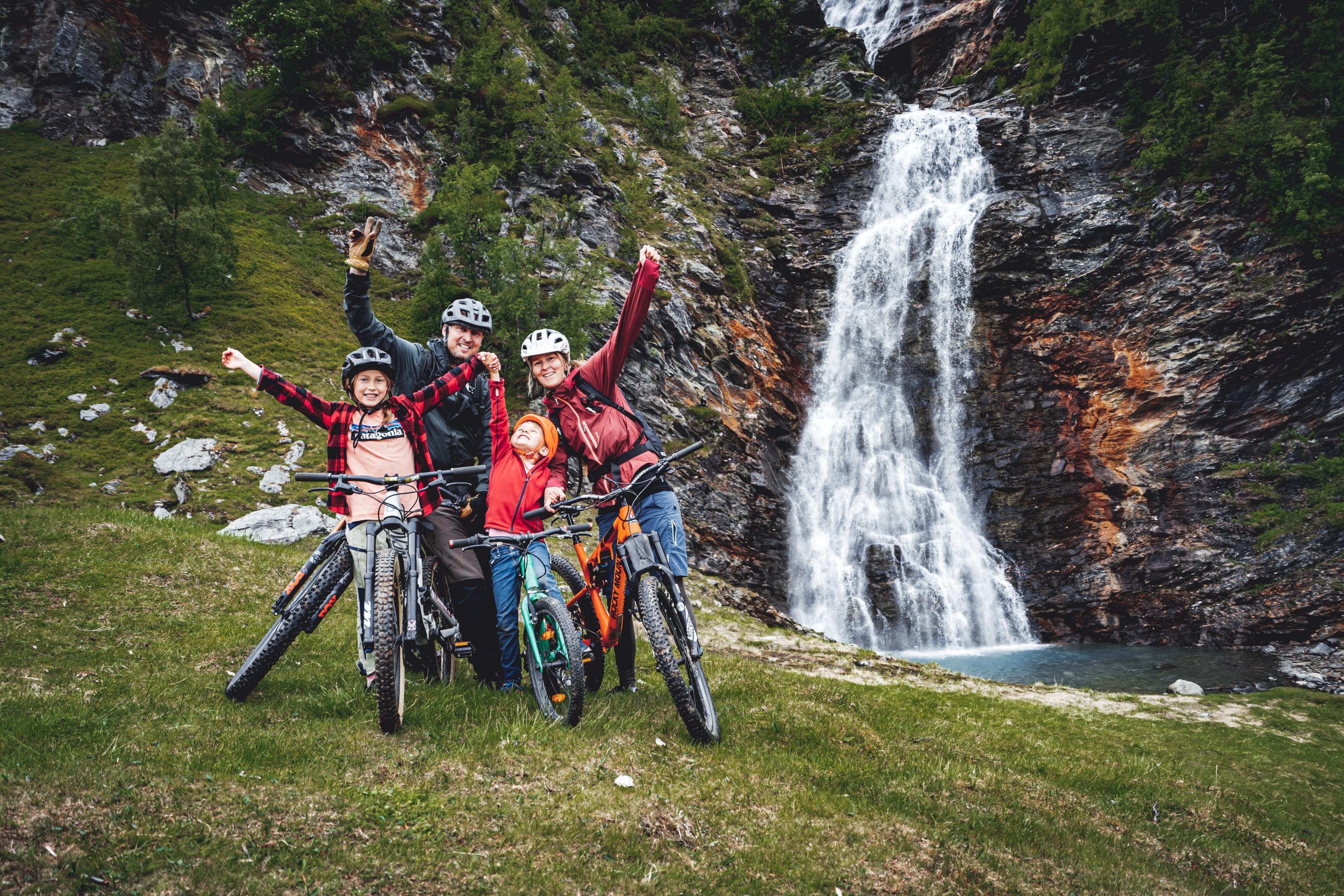 Family biking by the Rottenvik waterfall