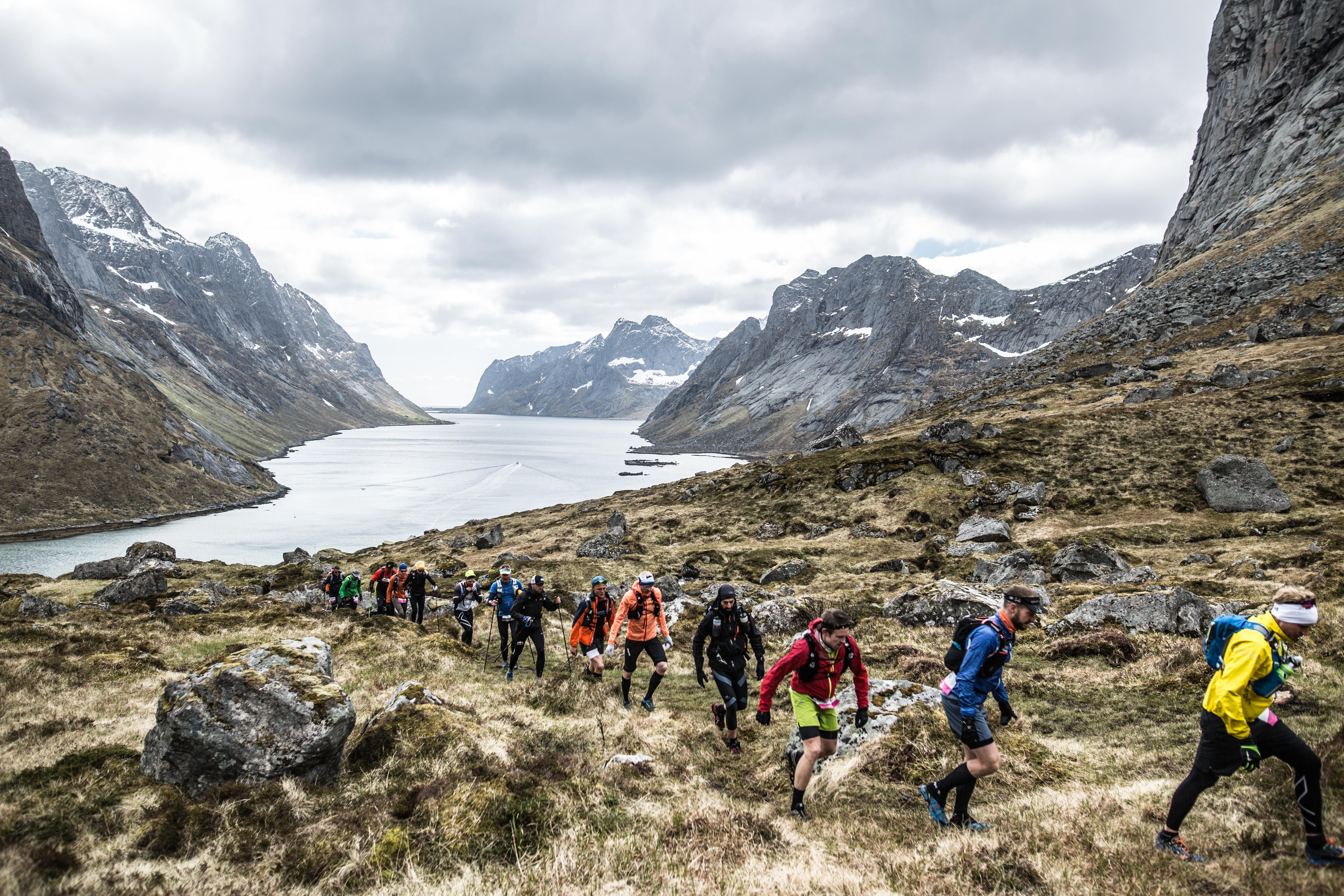 Contestants running in the mountains during The Arctic Triple on Lofoten in Northern Norway