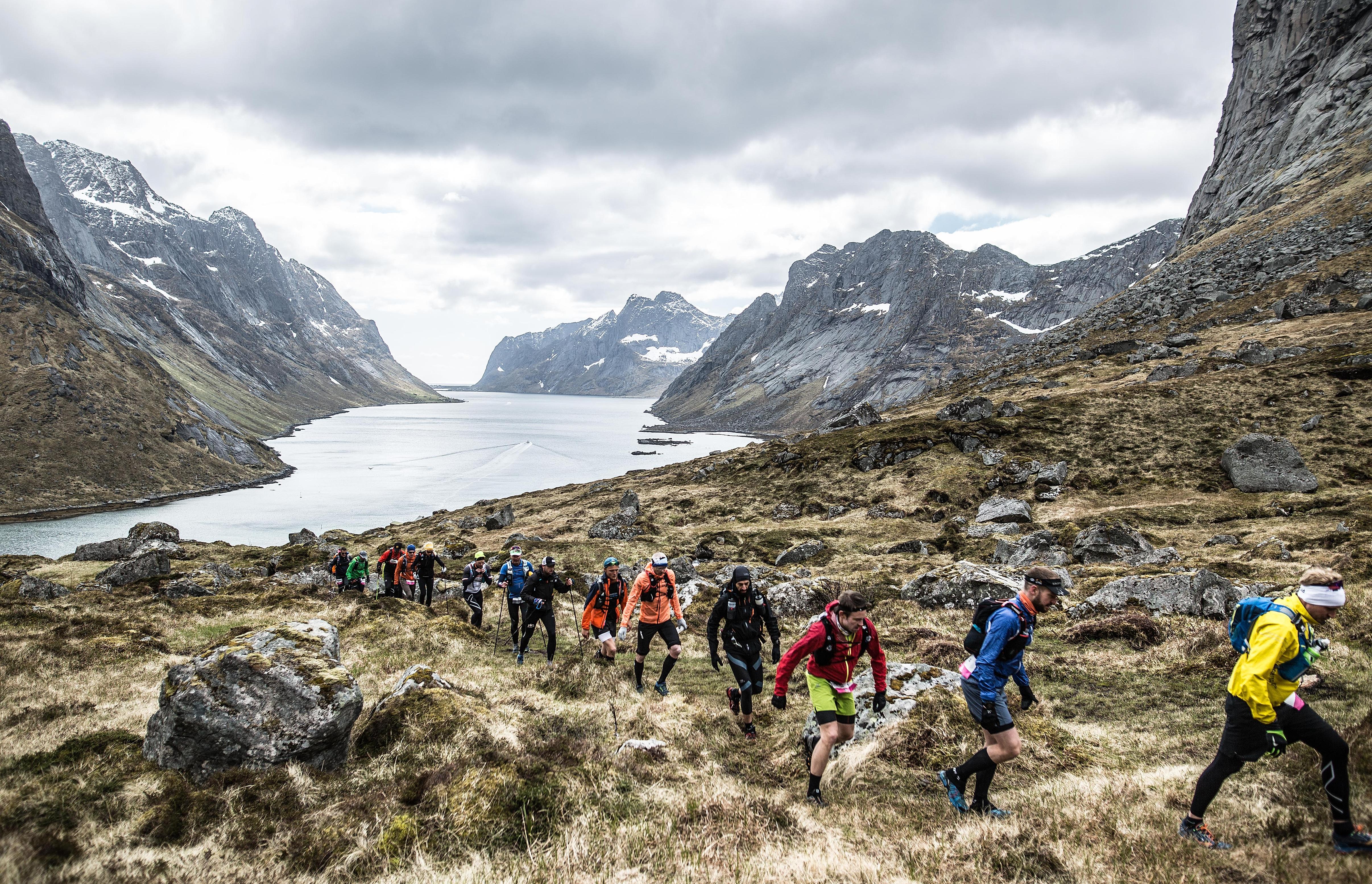 Contestants running in the mountains during The Arctic Triple on Lofoten in Northern Norway