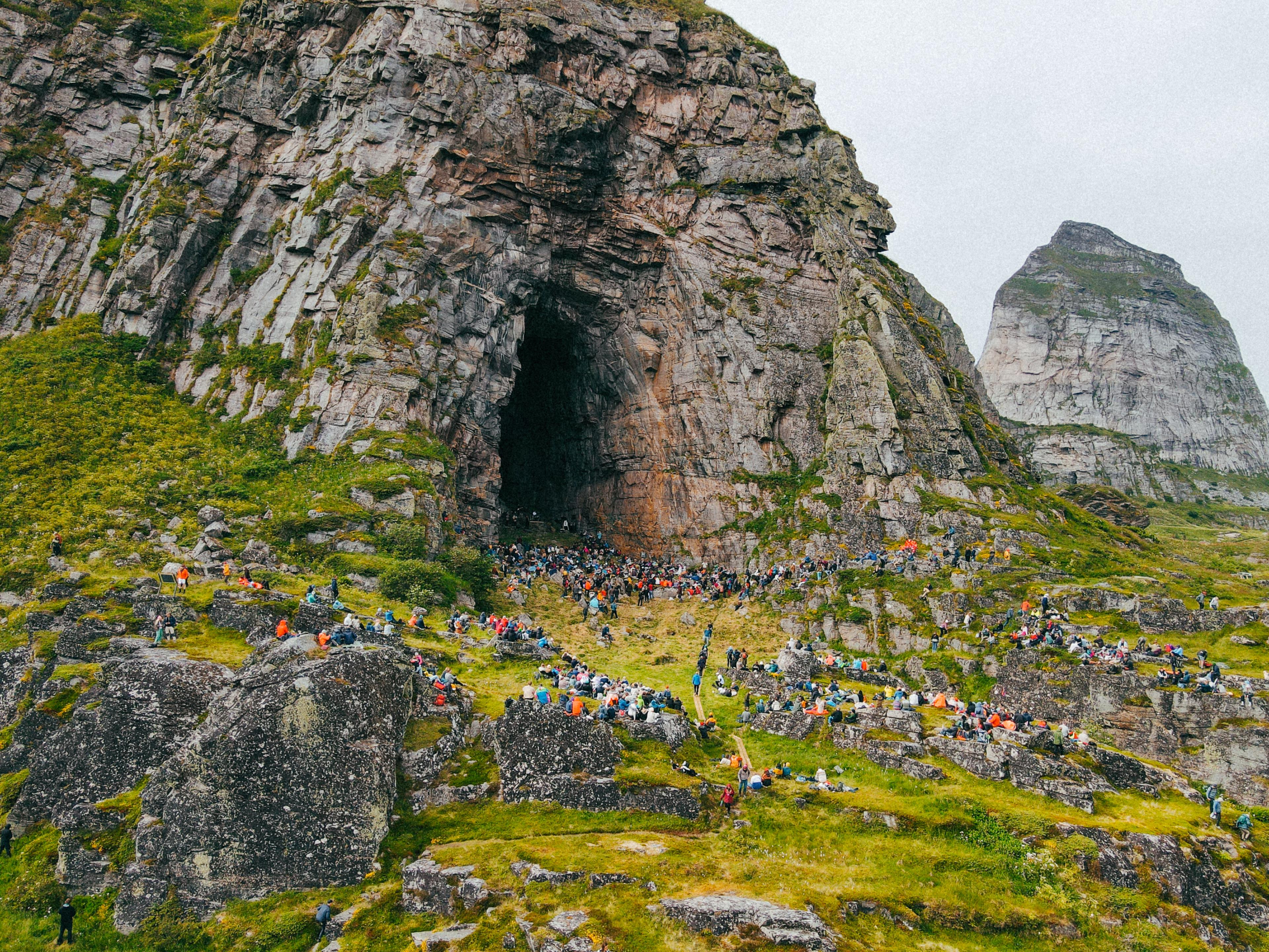 People at a concert in the Kirkhelleren cave in Træna, Helgeland, Northern Norway