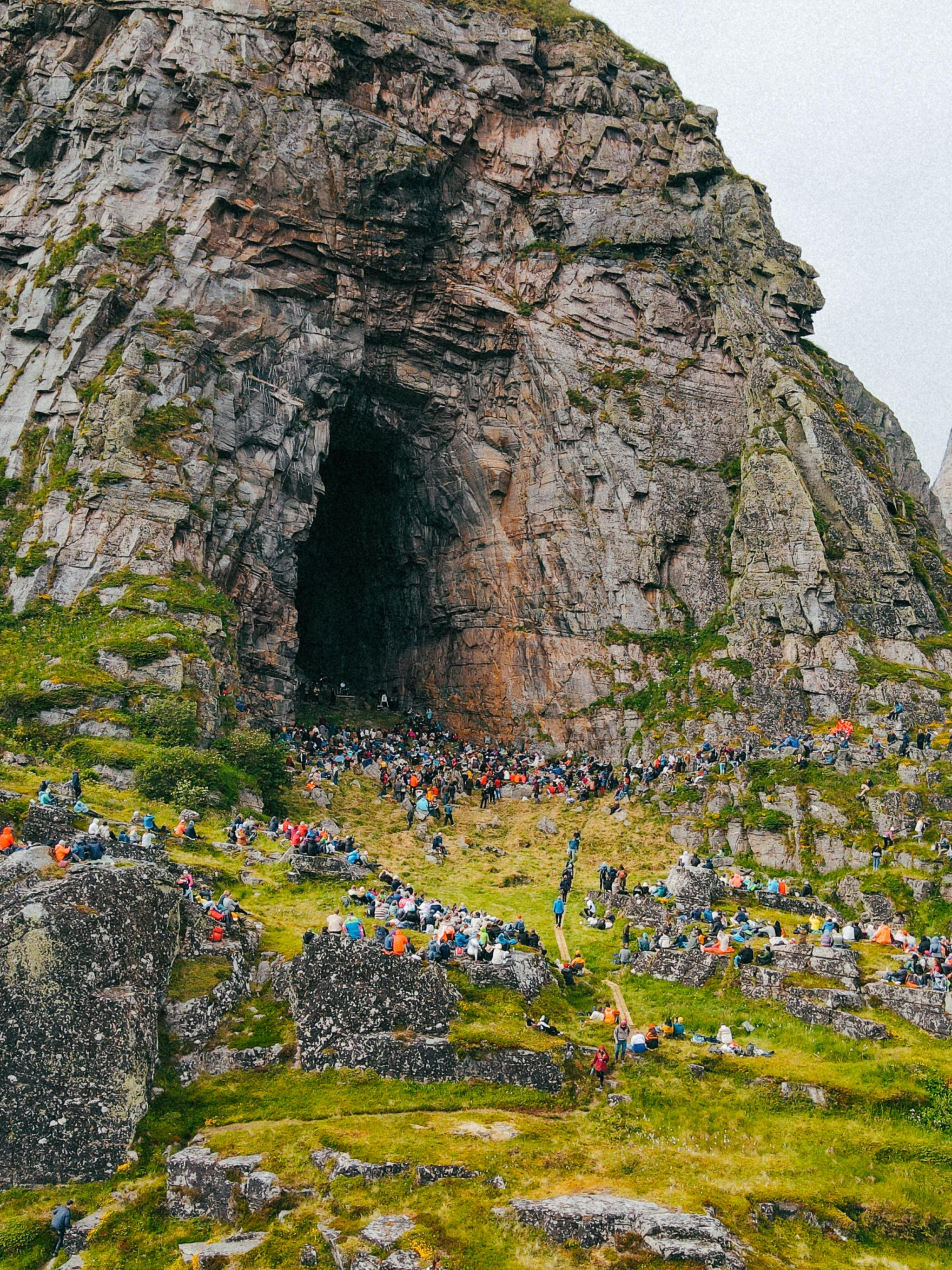 People at a concert in the Kirkhelleren cave in Træna, Helgeland, Northern Norway