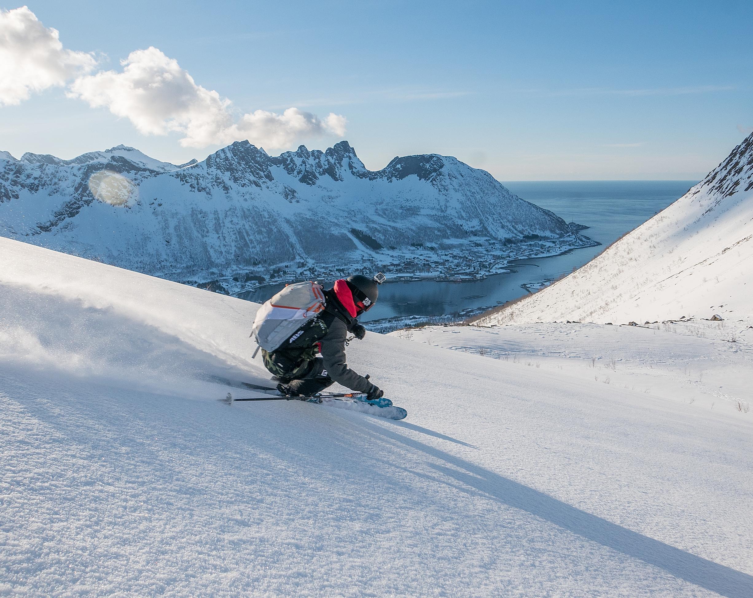 A person skiing down a mountain in Senja