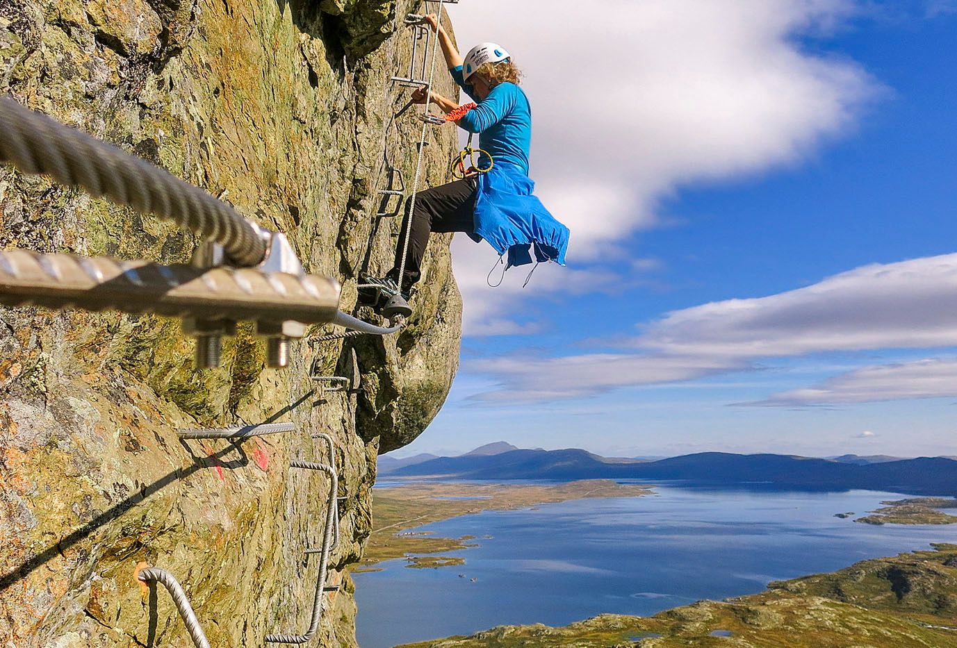Woman climbing Via Ferrata Synshorn