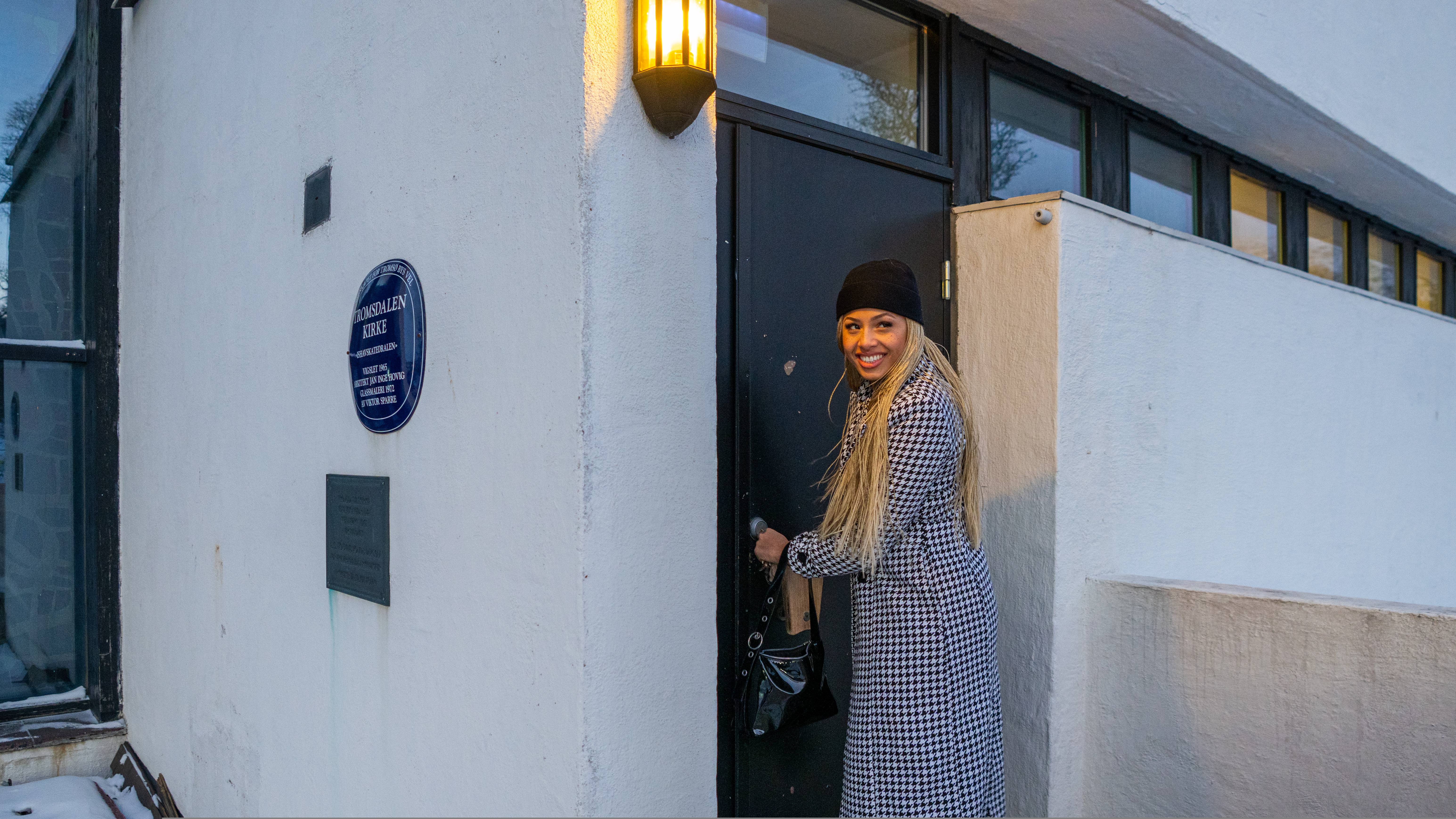 Artist Ida Tolou locking herself into the Arctic Cathedral in Tromsø
