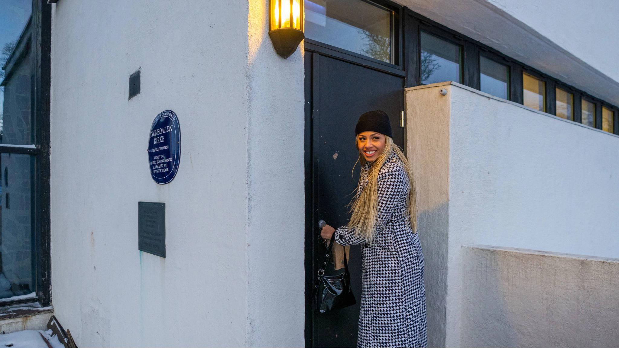 Artist Ida Tolou locking herself into the Arctic Cathedral in Tromsø