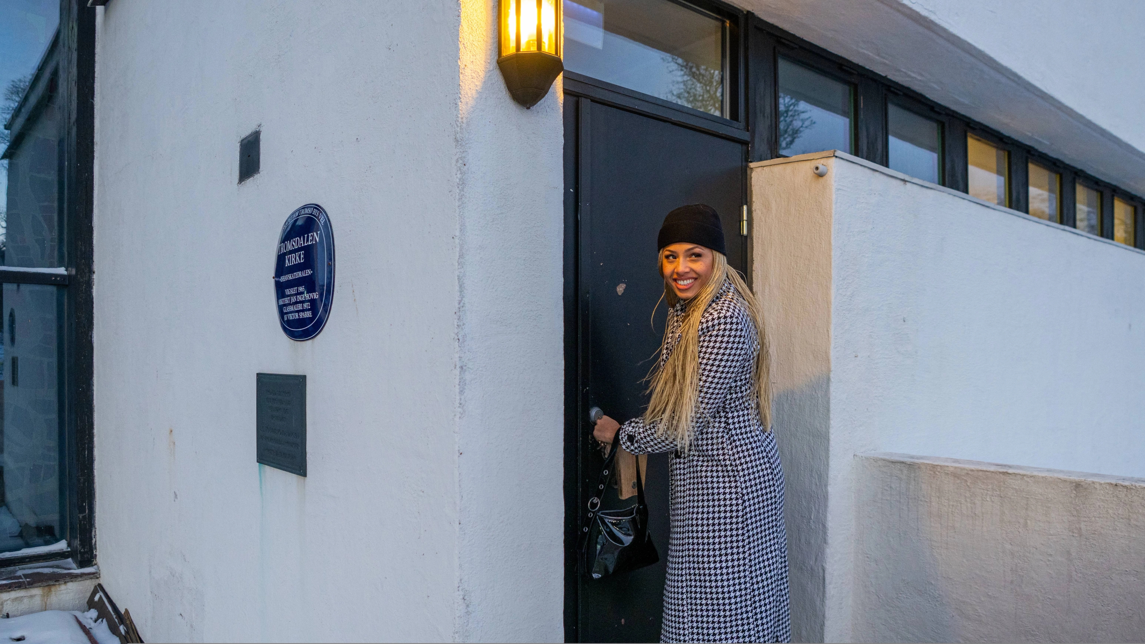Artist Ida Tolou locking herself into the Arctic Cathedral in Tromsø