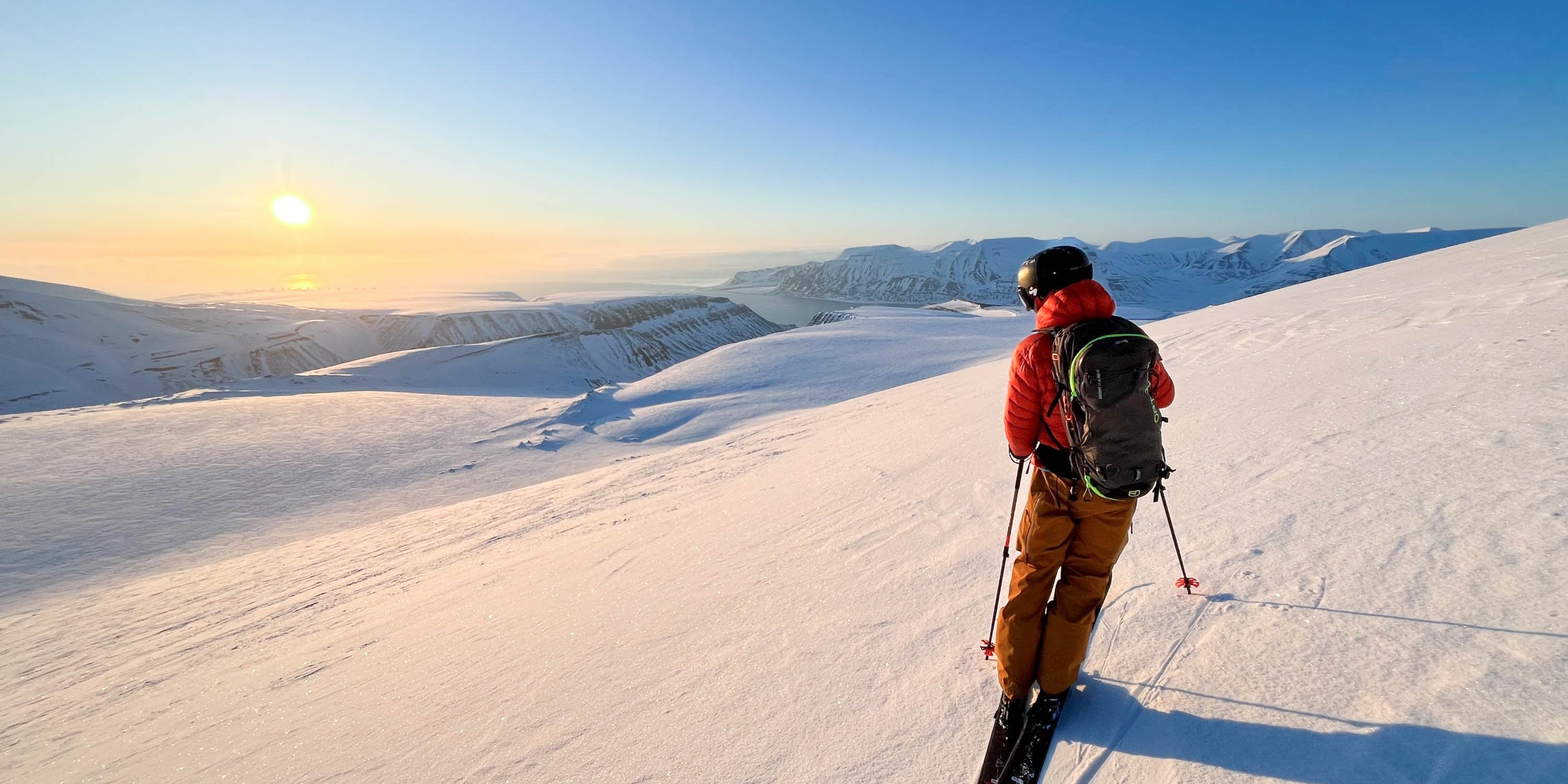 A person ski touring in sunny weather.