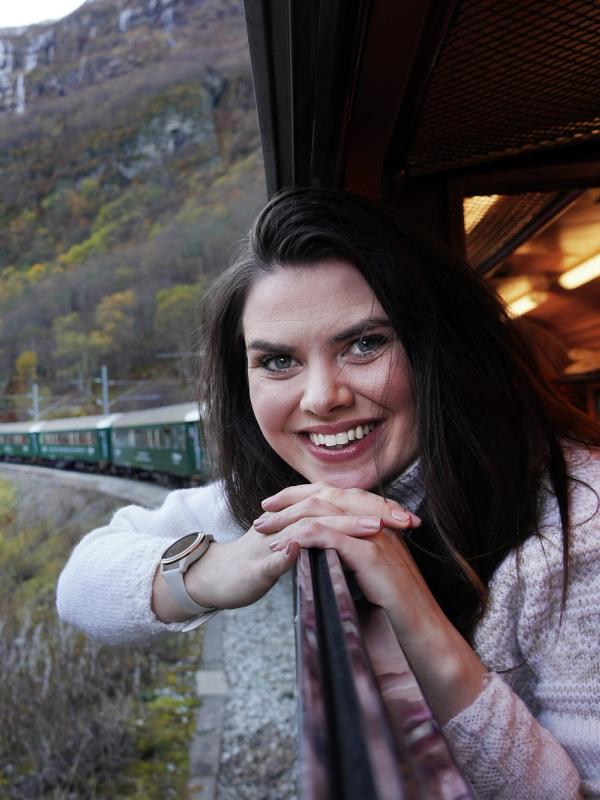 Woman looking out of a train window