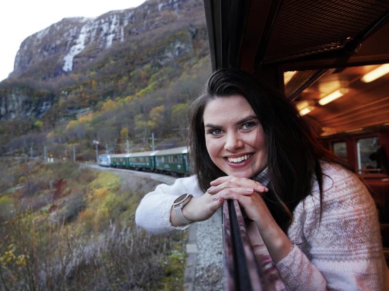 Woman looking out of a train window