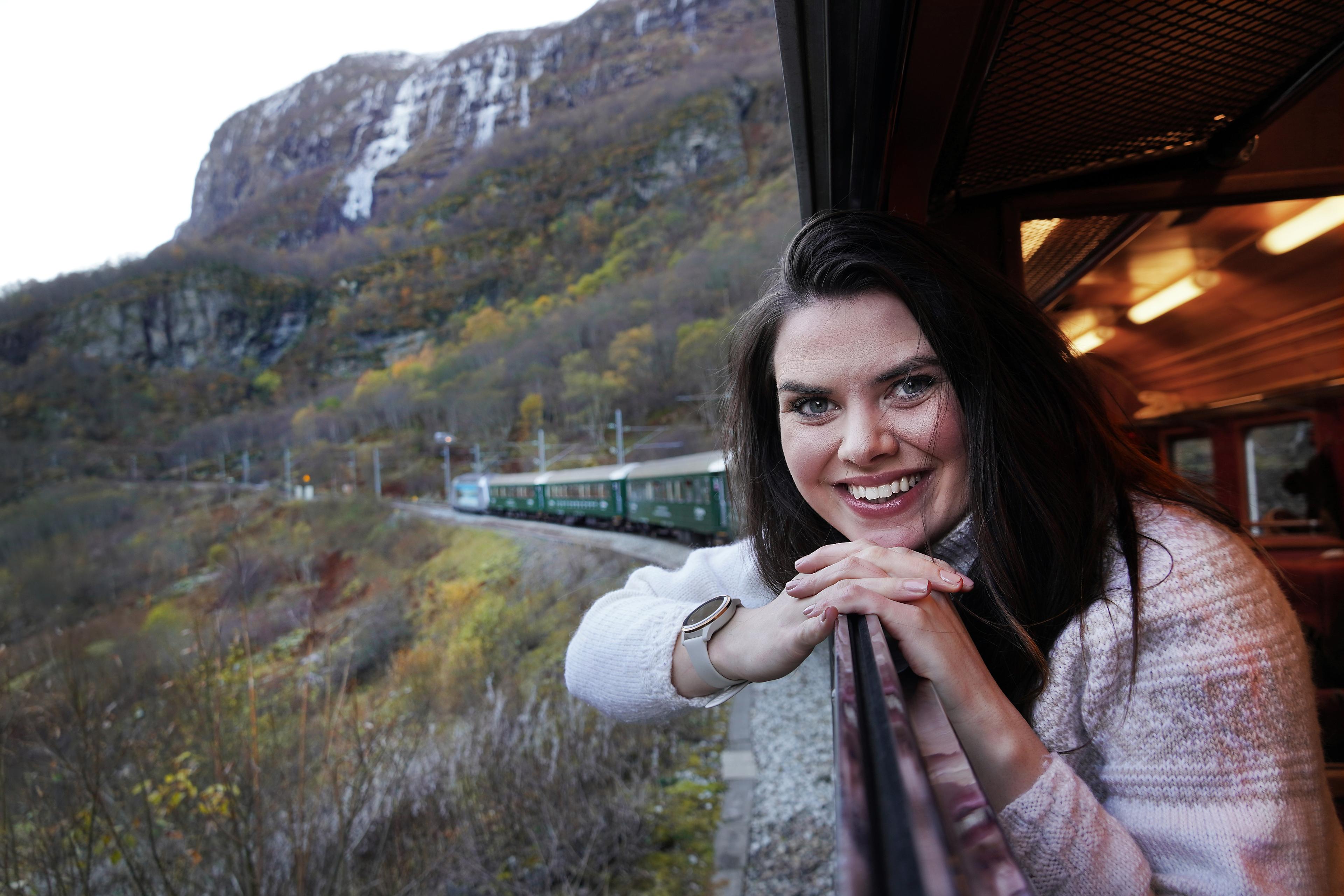 Woman looking out of a train window