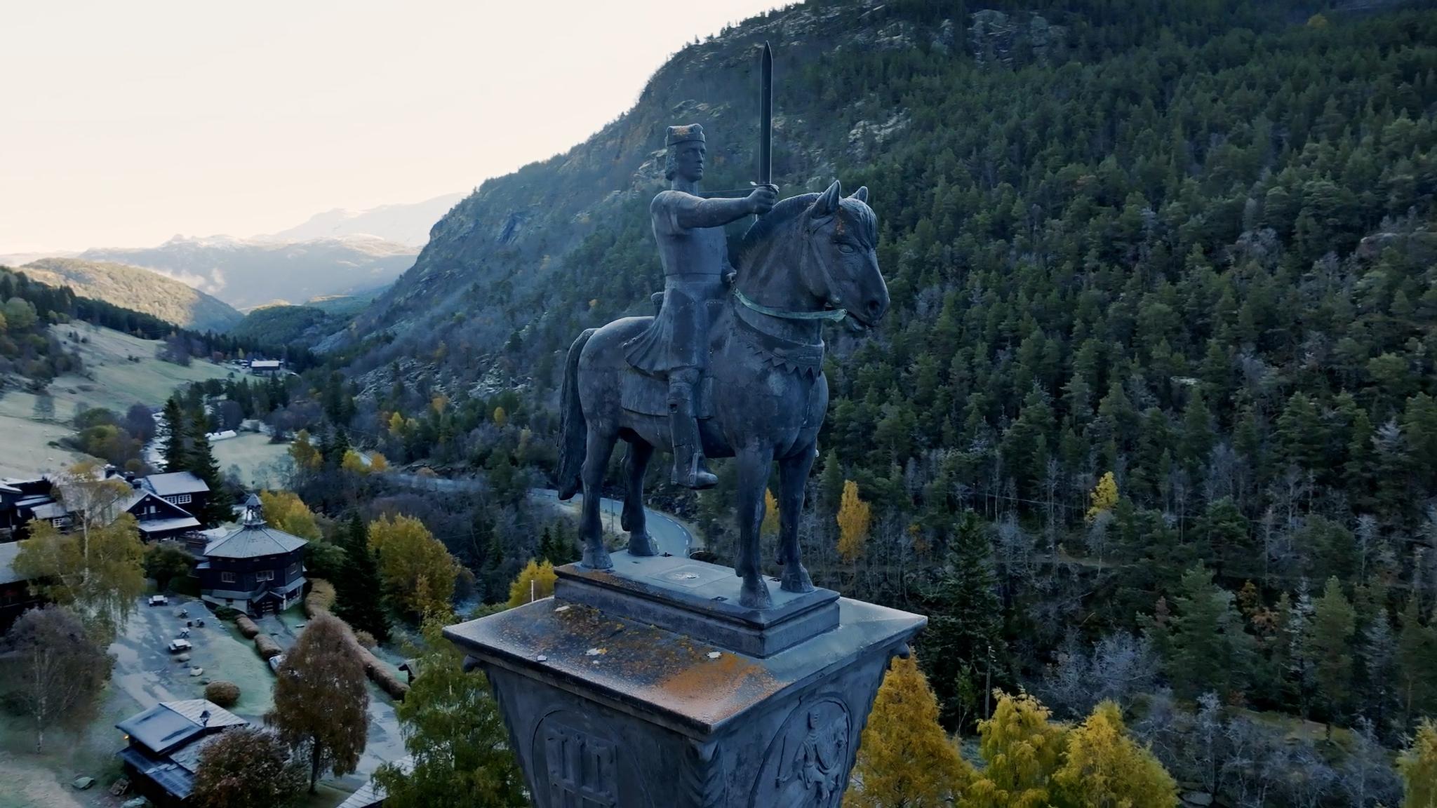 A sculpture in autumn landscape.