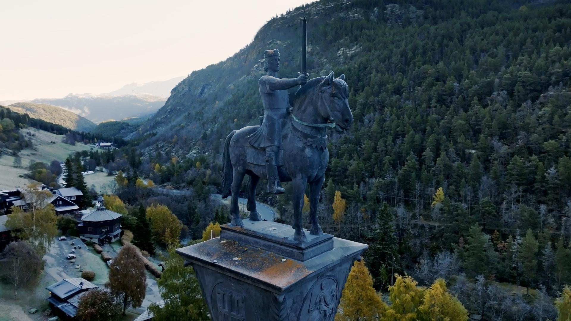 A sculpture in autumn landscape.
