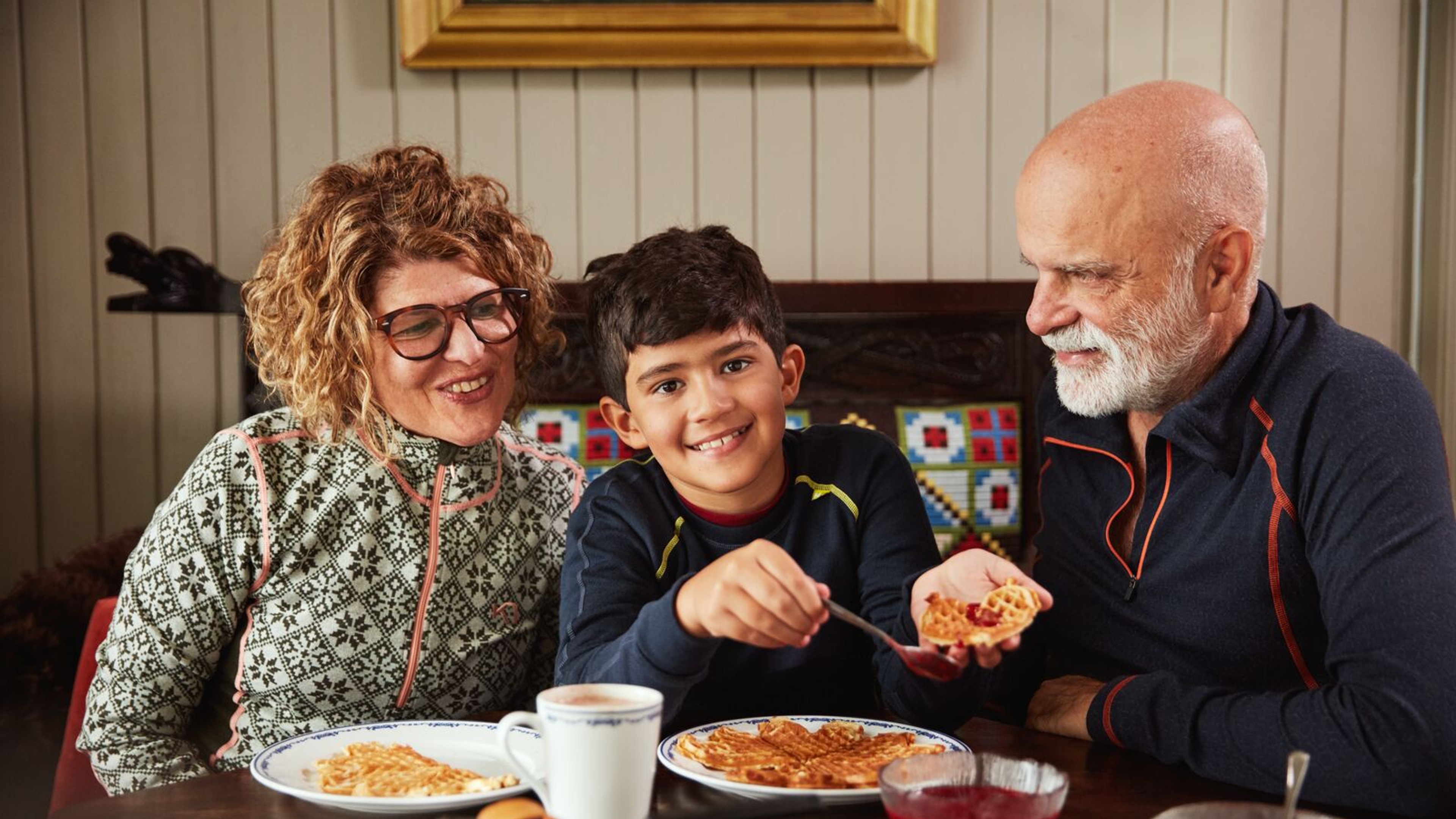 A family eating waffles