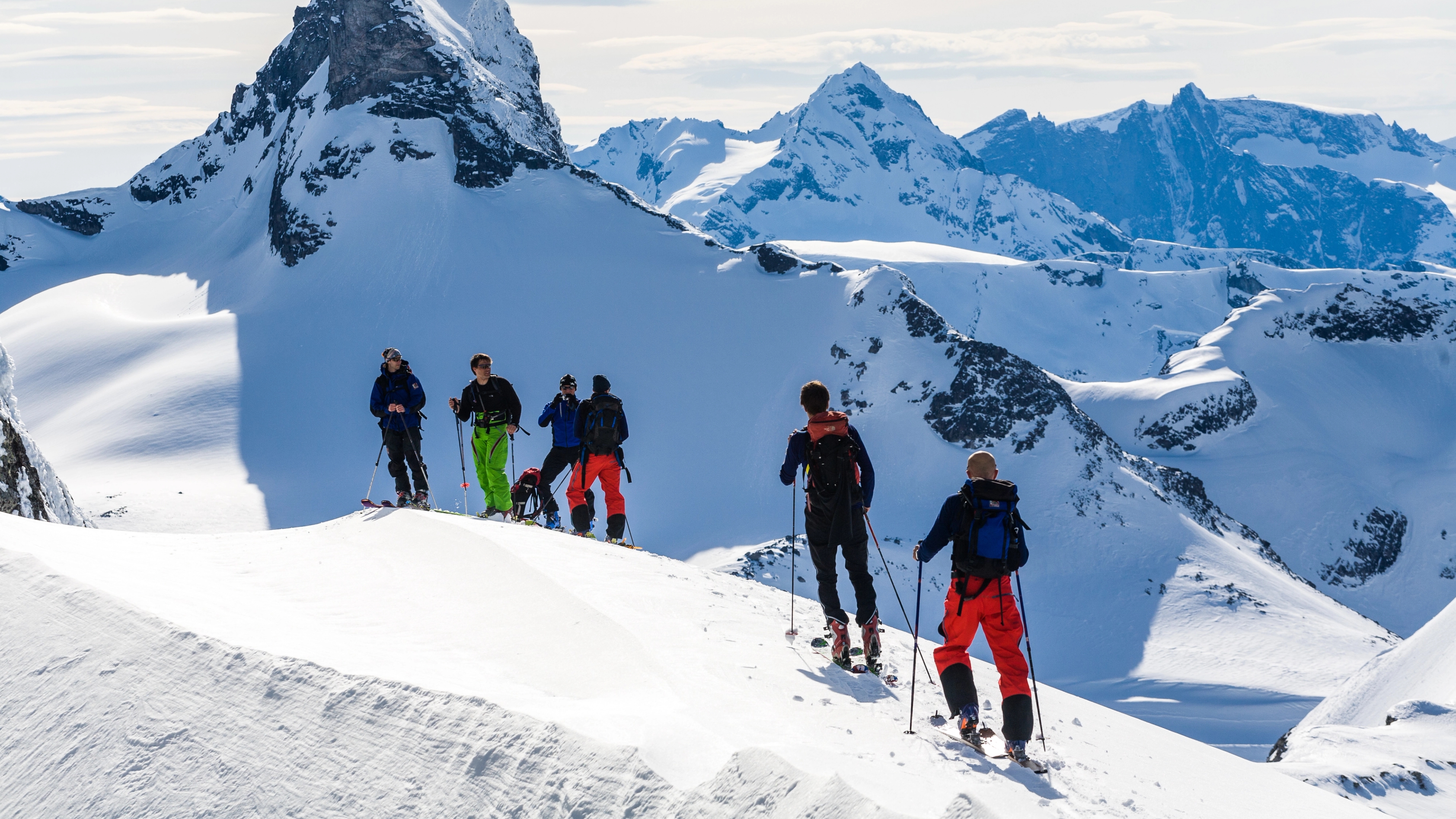 People ski touring to Nyheitind in the Northwest in Fjord Norway
