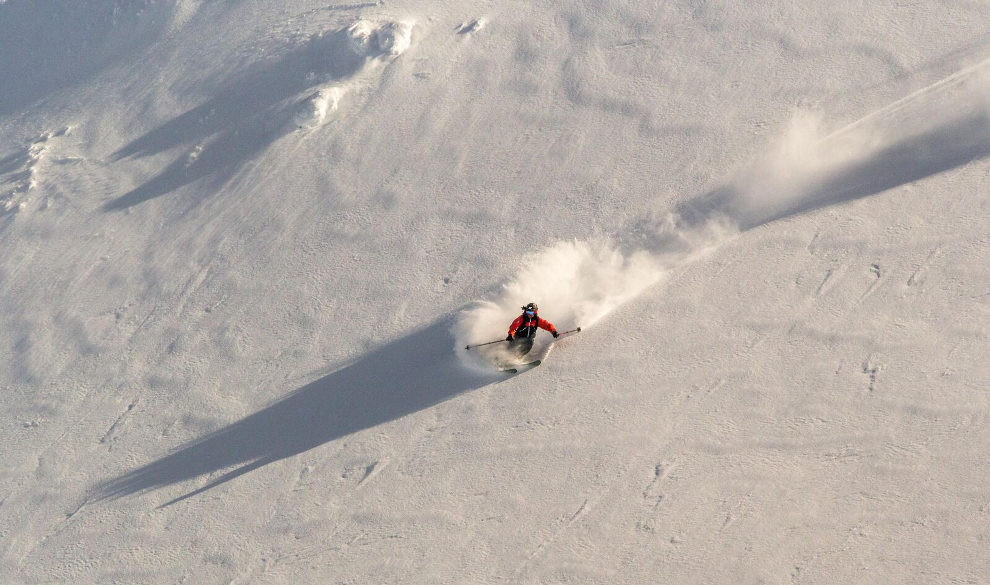 Skier downhill a mountain in Narvik in Northern Norway