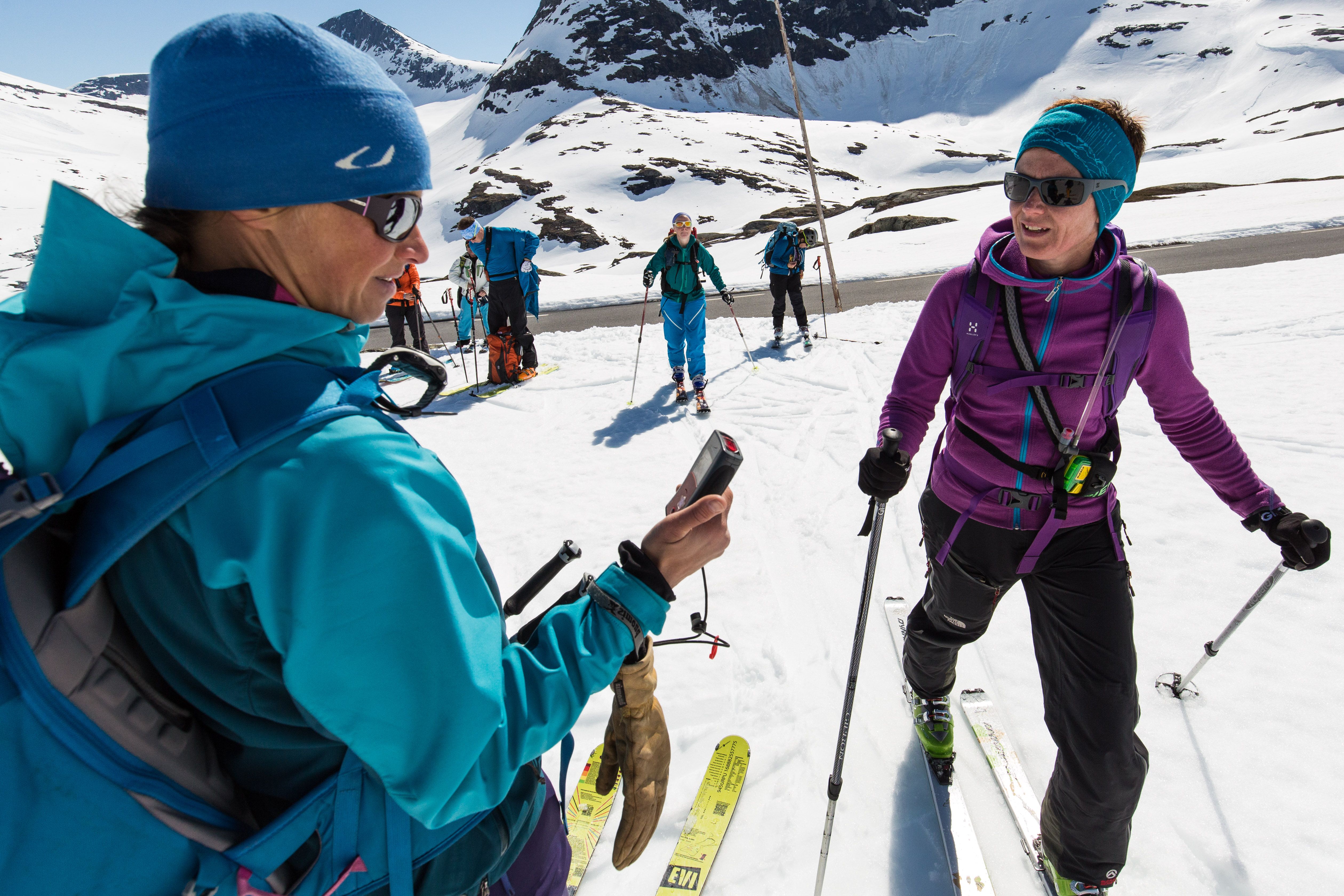 A group of skiers testing the avalanche equipment before they go ski touring