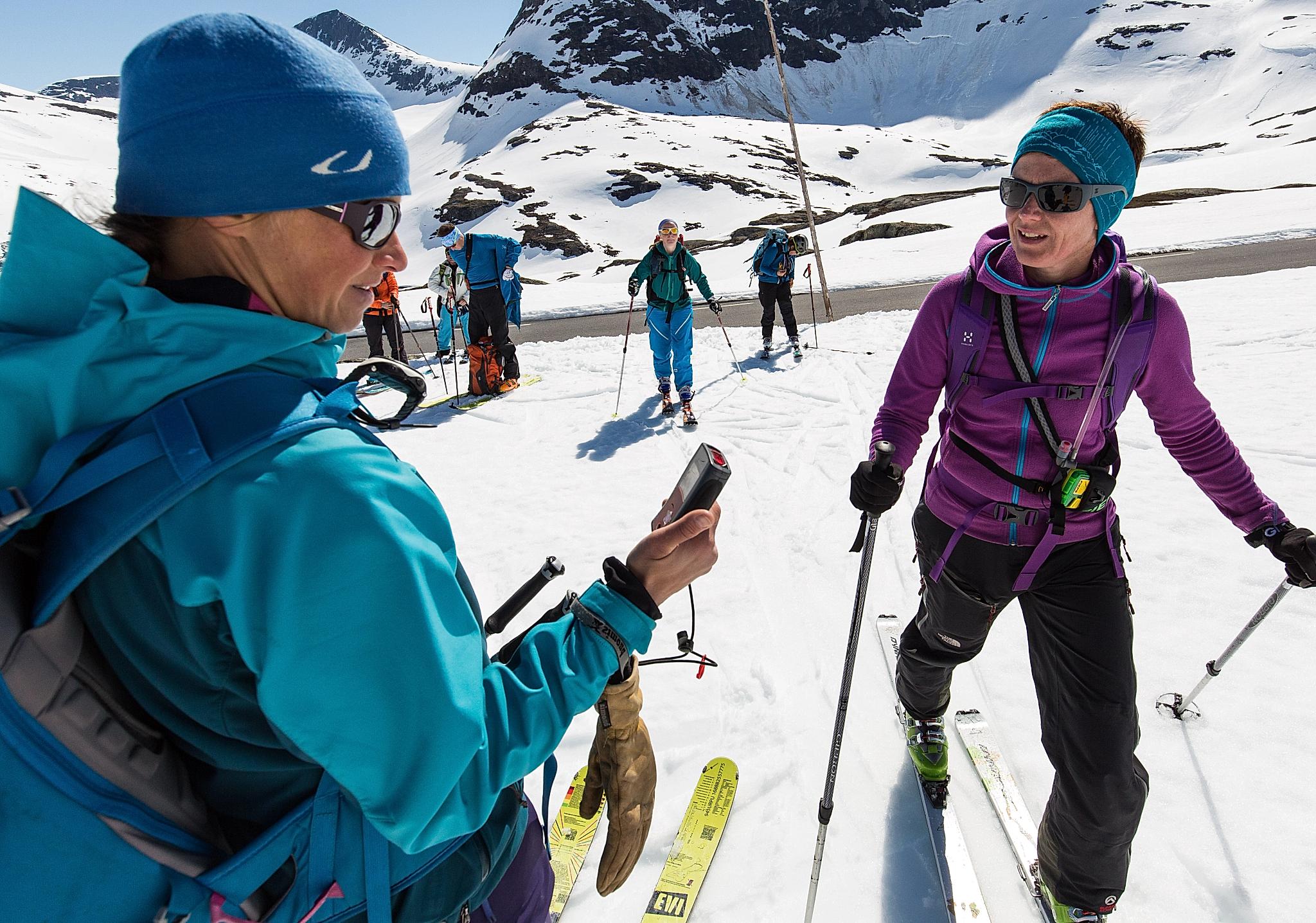 A group of skiers testing the avalanche equipment before they go ski touring