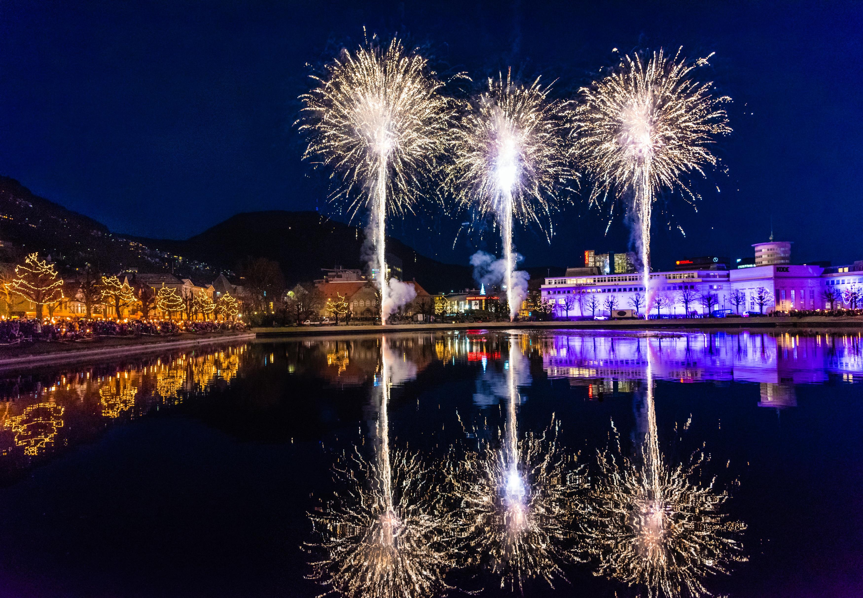 Christmas lights and fireworks light up the city of Bergen, Fjord Norway