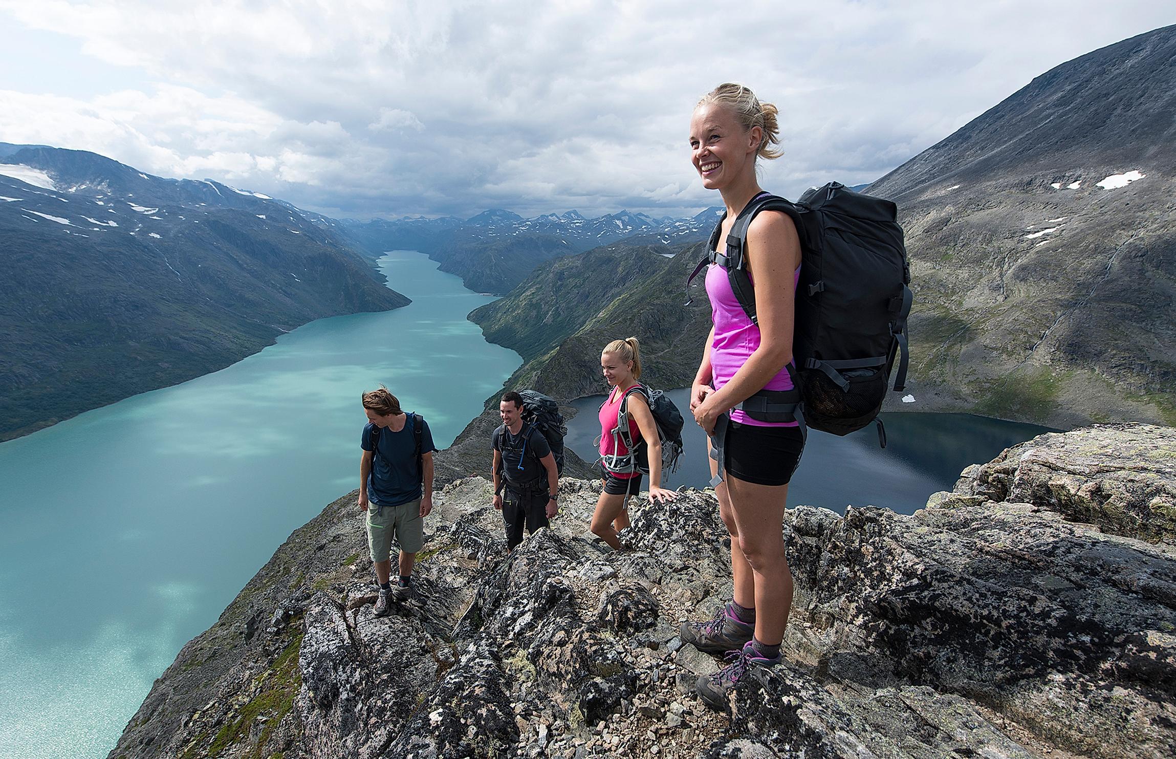Friends are hiking the Besseggen ridge in Jotunheimen, Eastern Norway