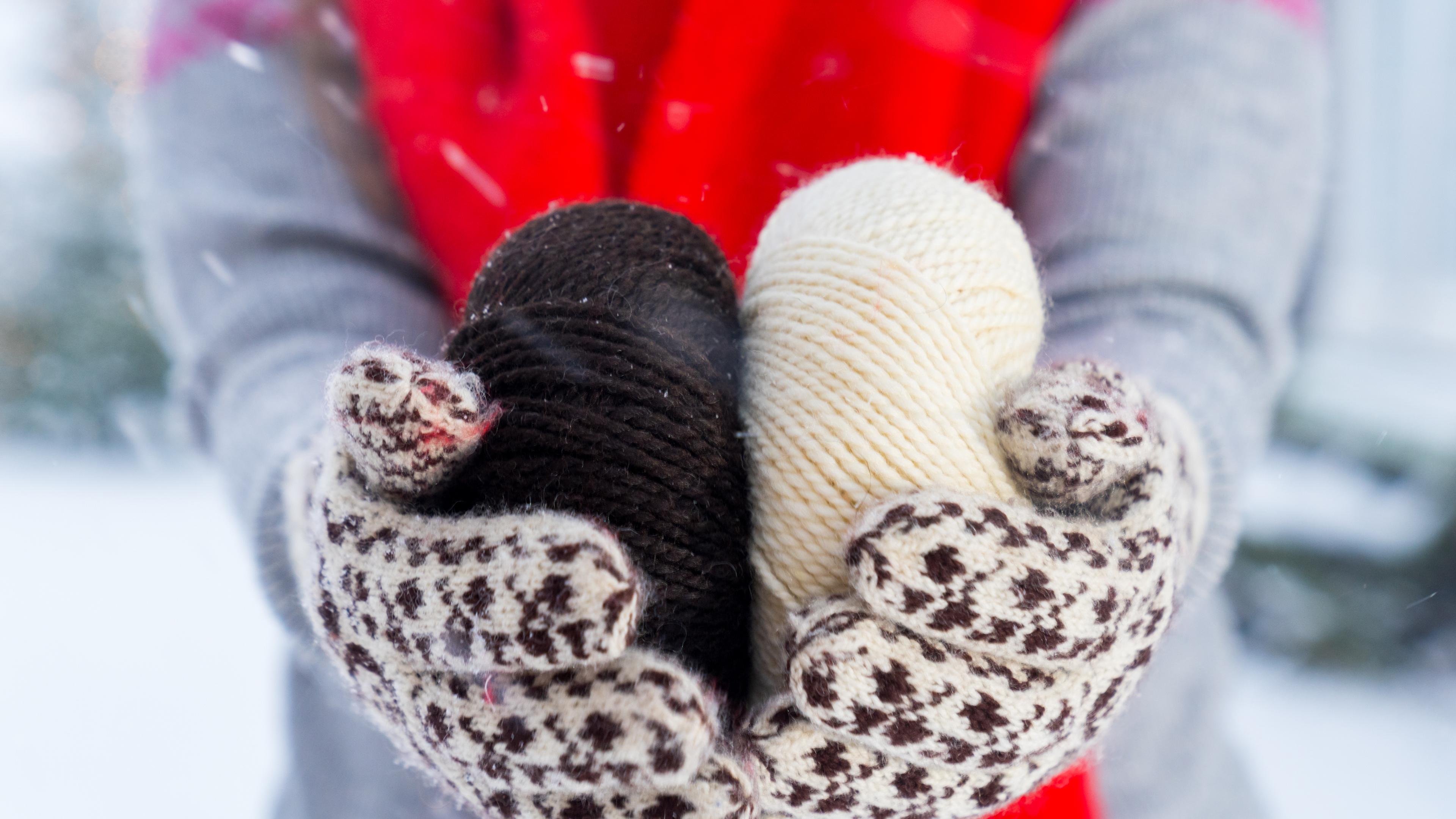 A woman holding yarn used to make Selbu mittens, Trøndelag, Norway.