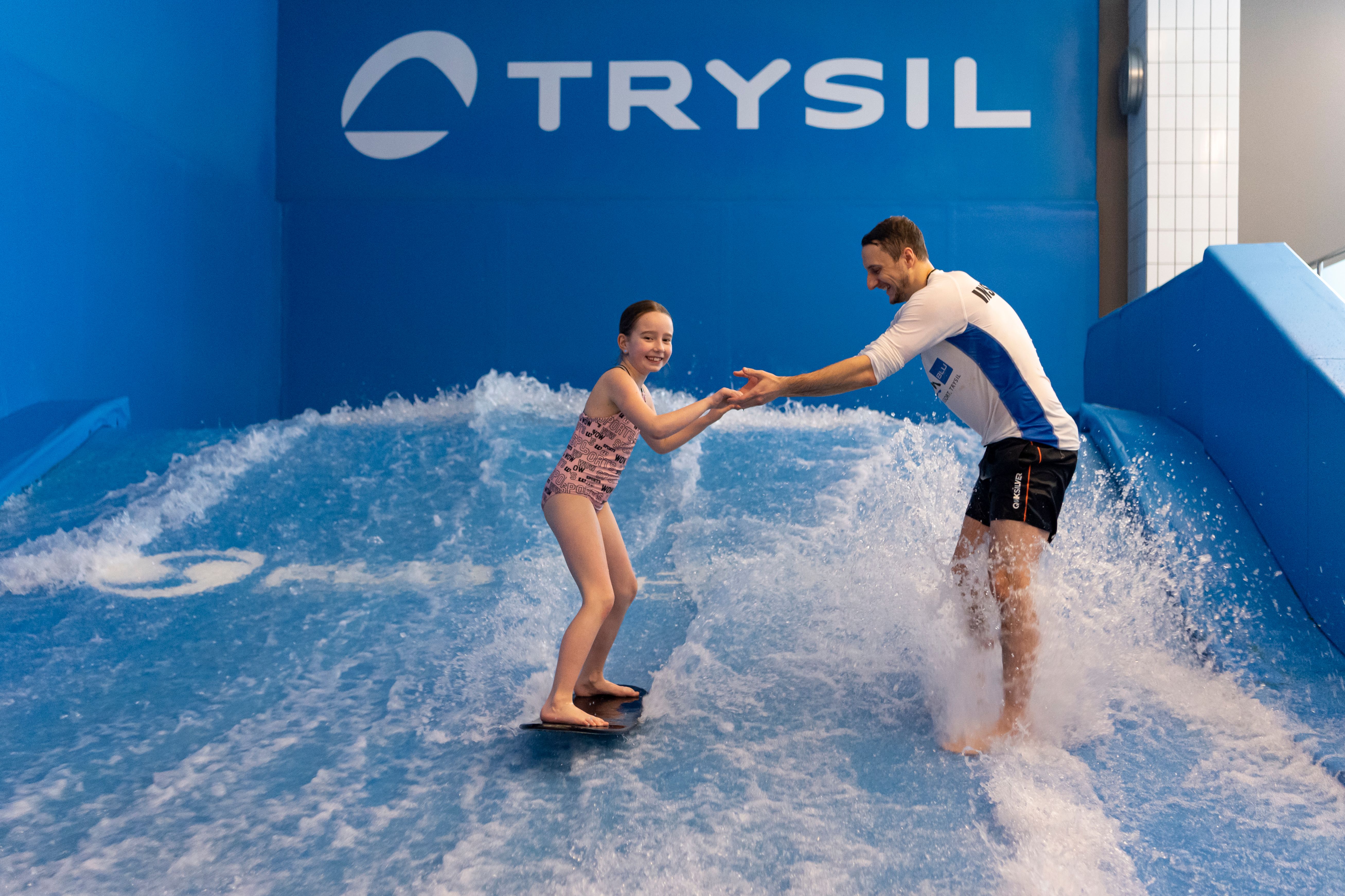 Girl testing the surf wave at Radisson Blu Resort Trysil