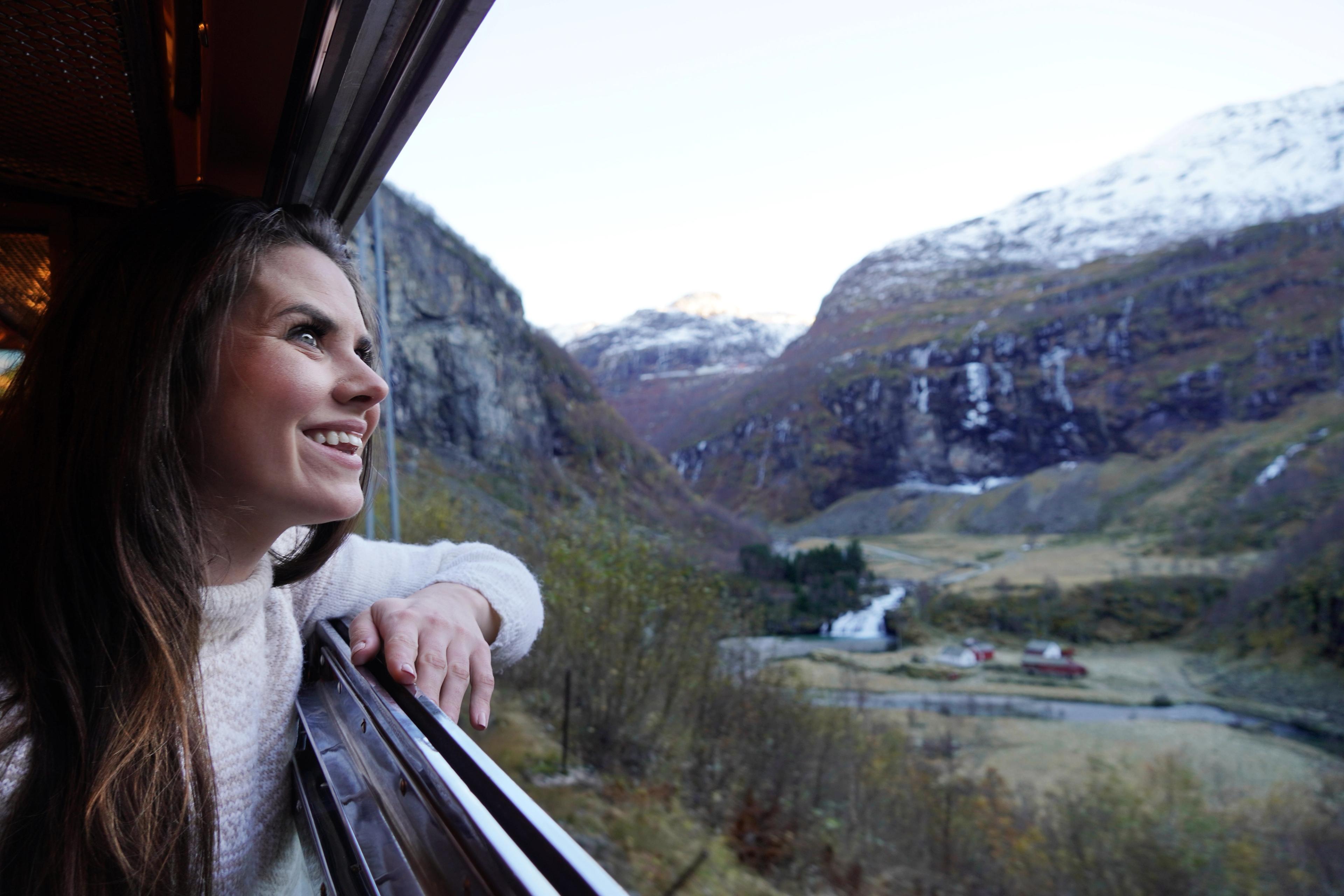 Woman looking out of a train window