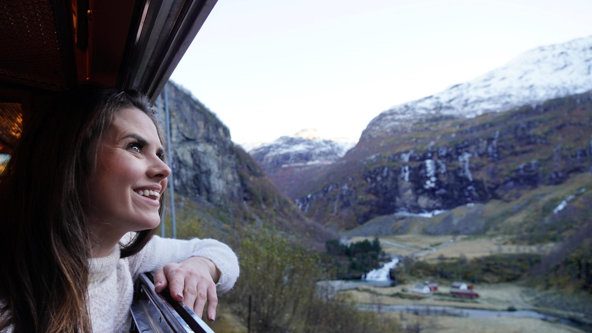 Woman looking out of a train window