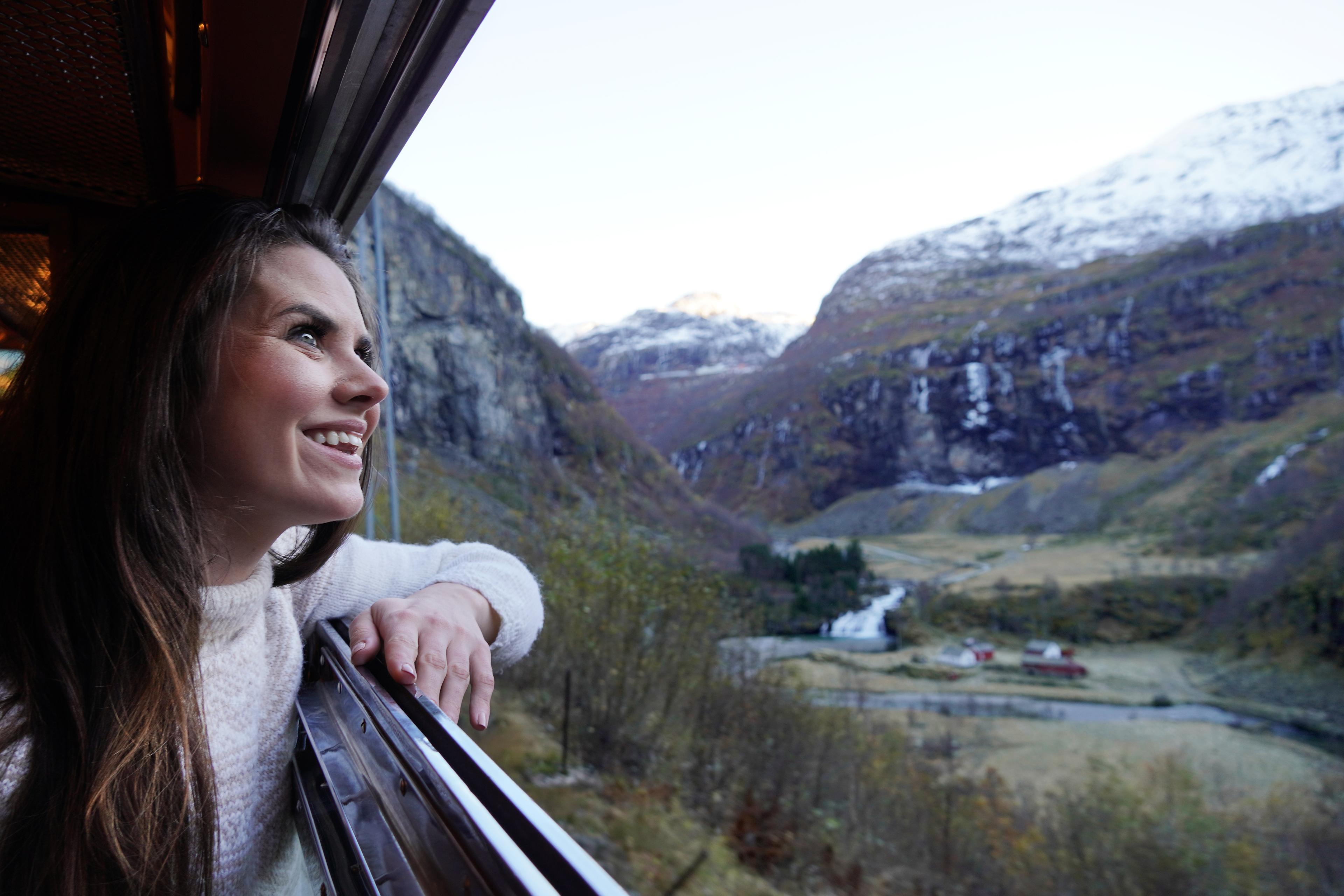 Woman looking out of a train window