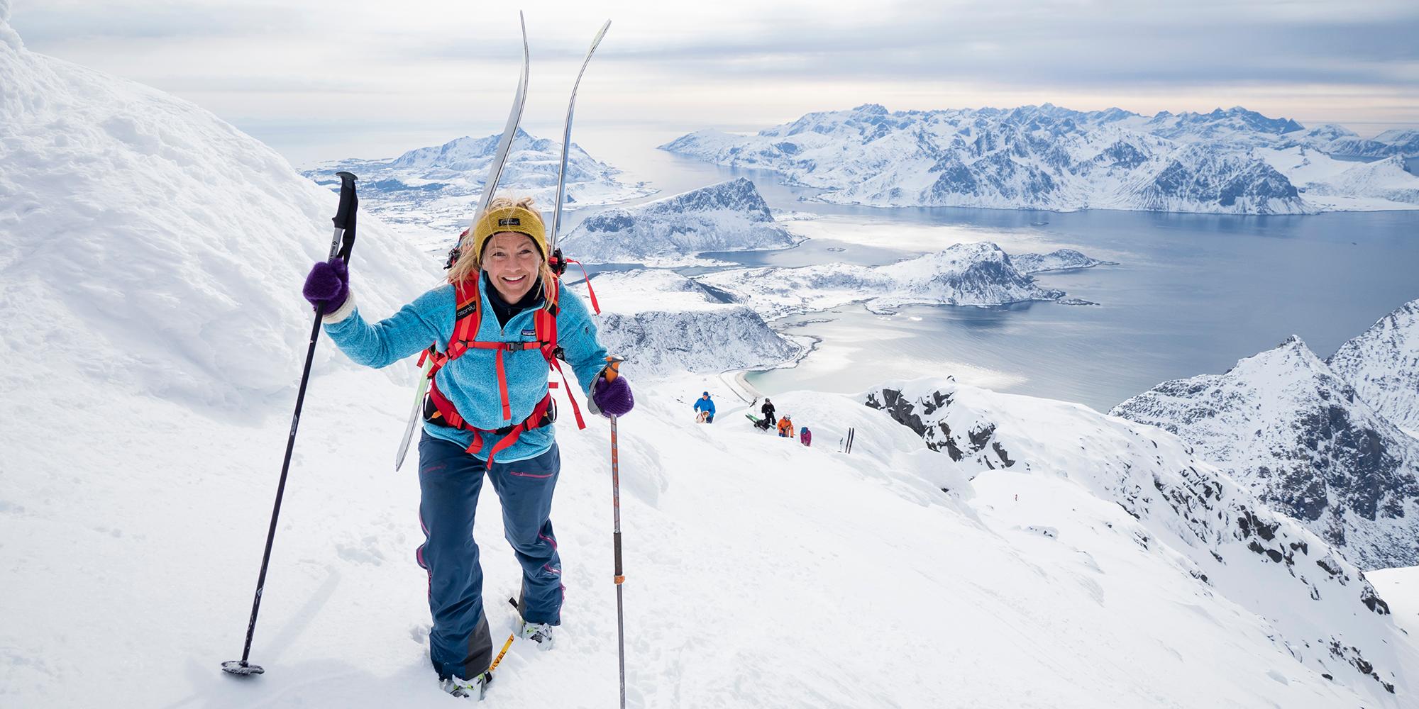 Woman climbing mount Himmeltind on a ski touring trip in Lofoten, Northern Norway