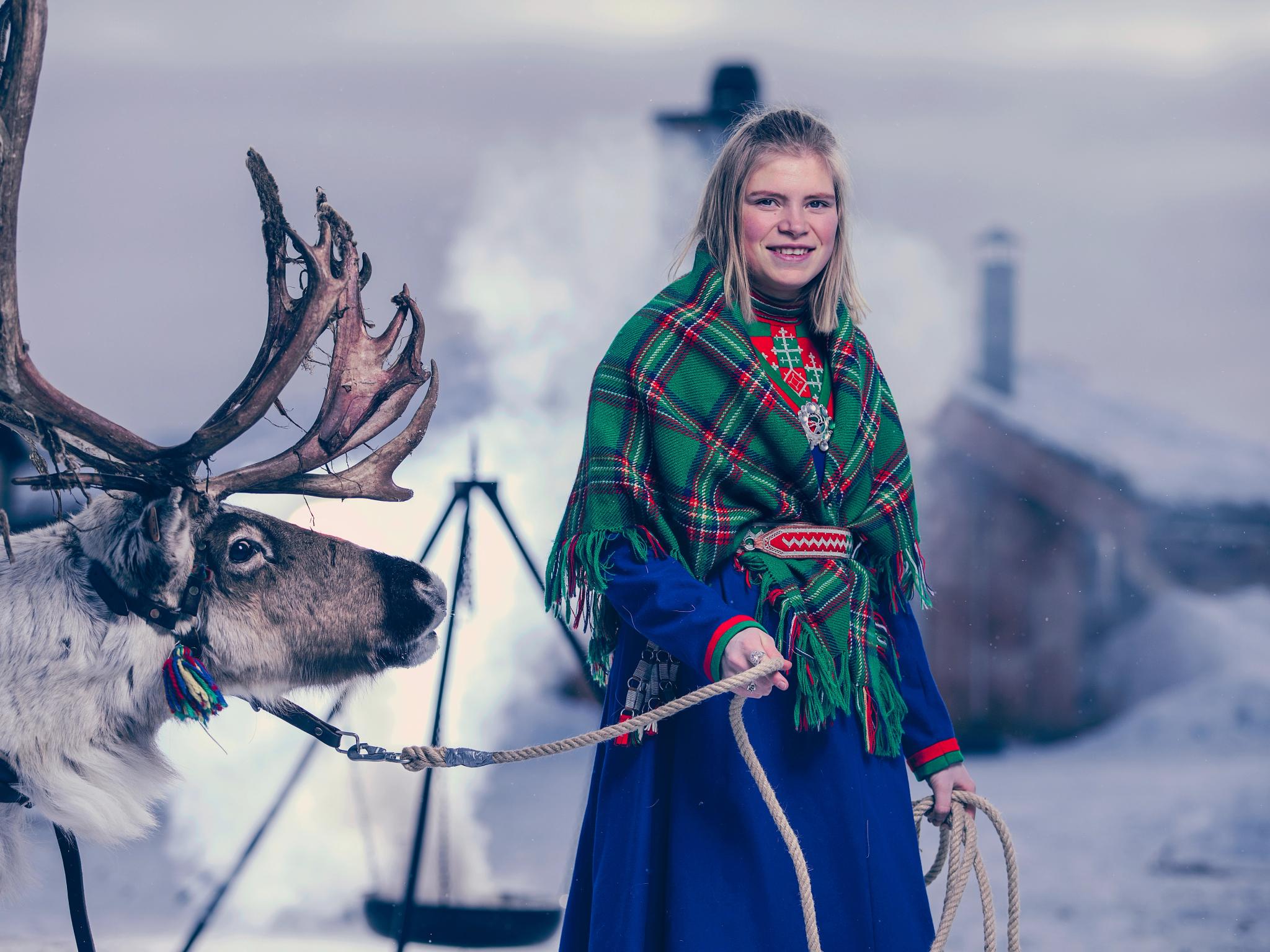 Young Sami woman with a reindeer in Røros