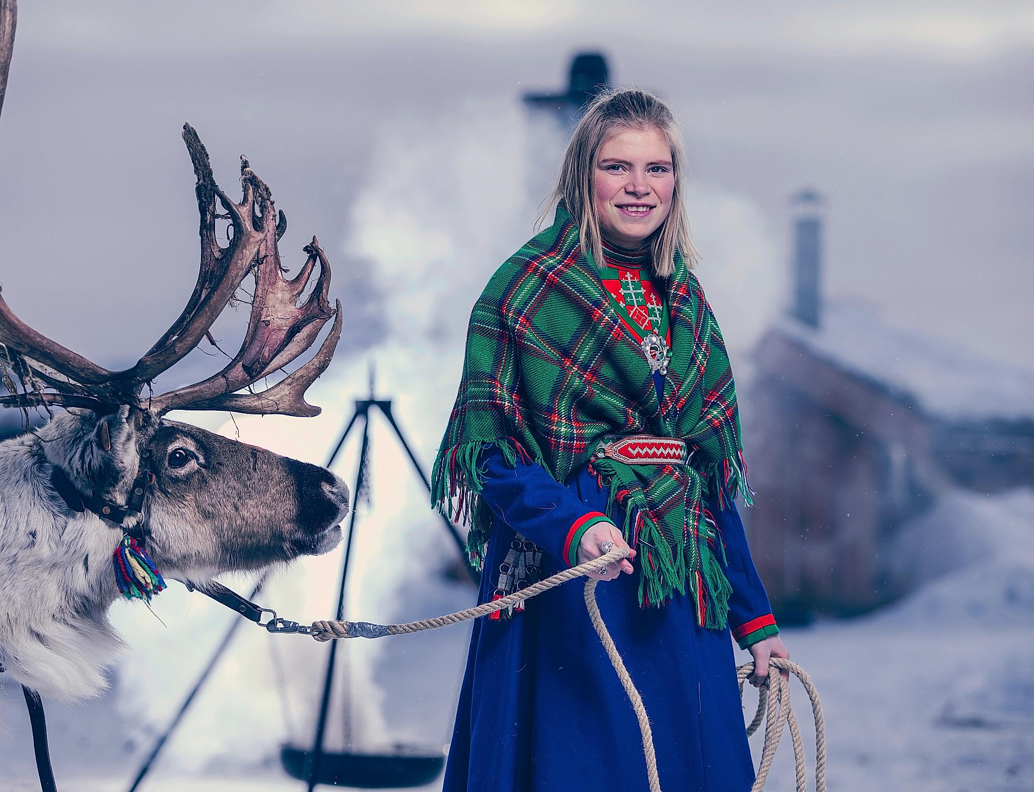 Young Sami woman with a reindeer in Røros