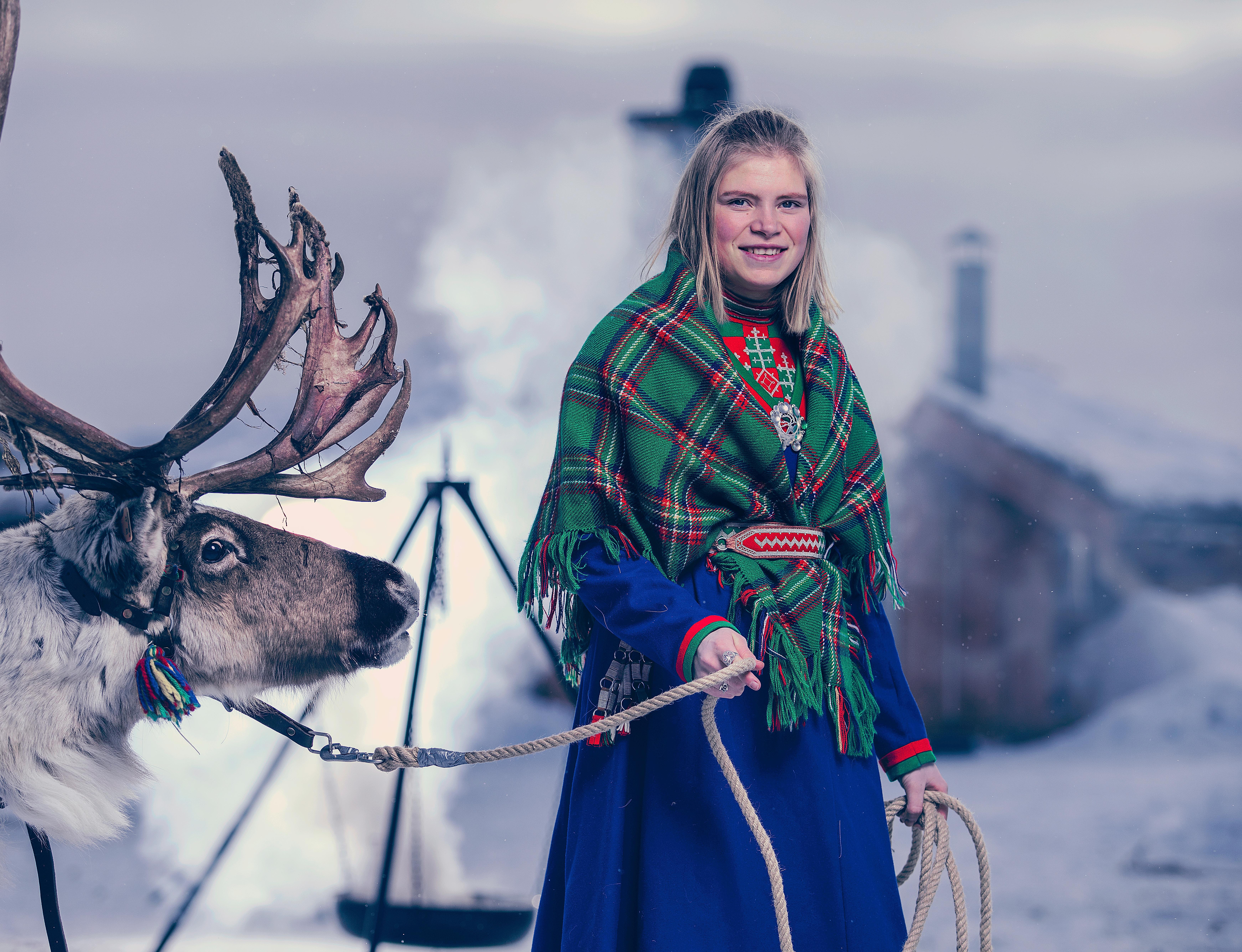 Young Sami woman with a reindeer in Røros