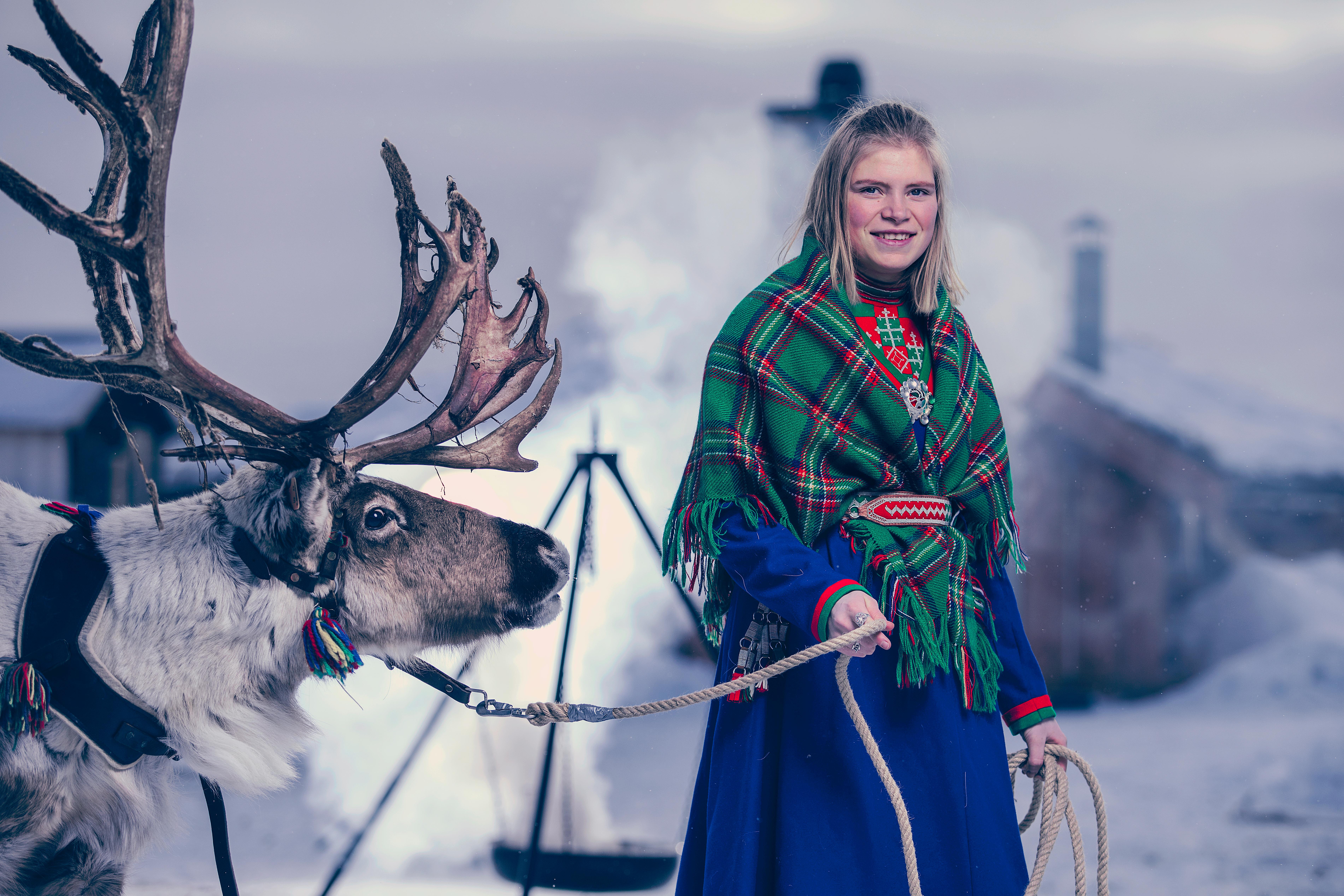 Young Sami woman with a reindeer in Røros