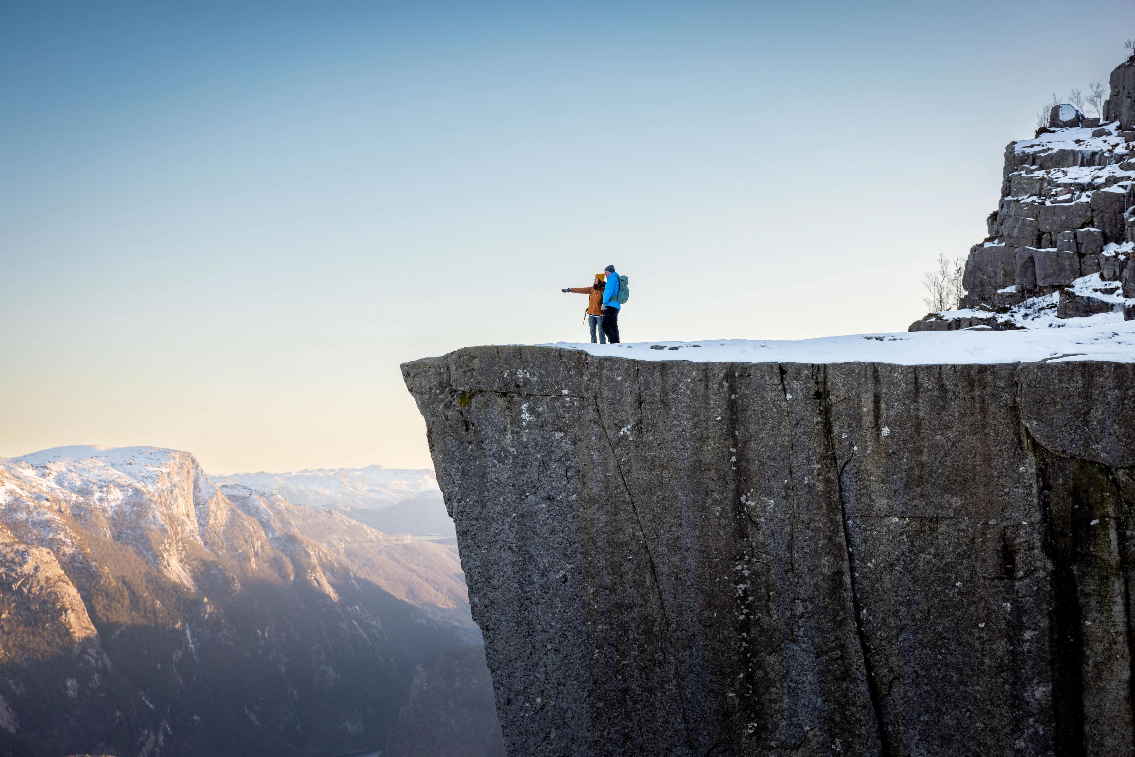 Two people on the Pulpit Rock, Preikestolen, Norway