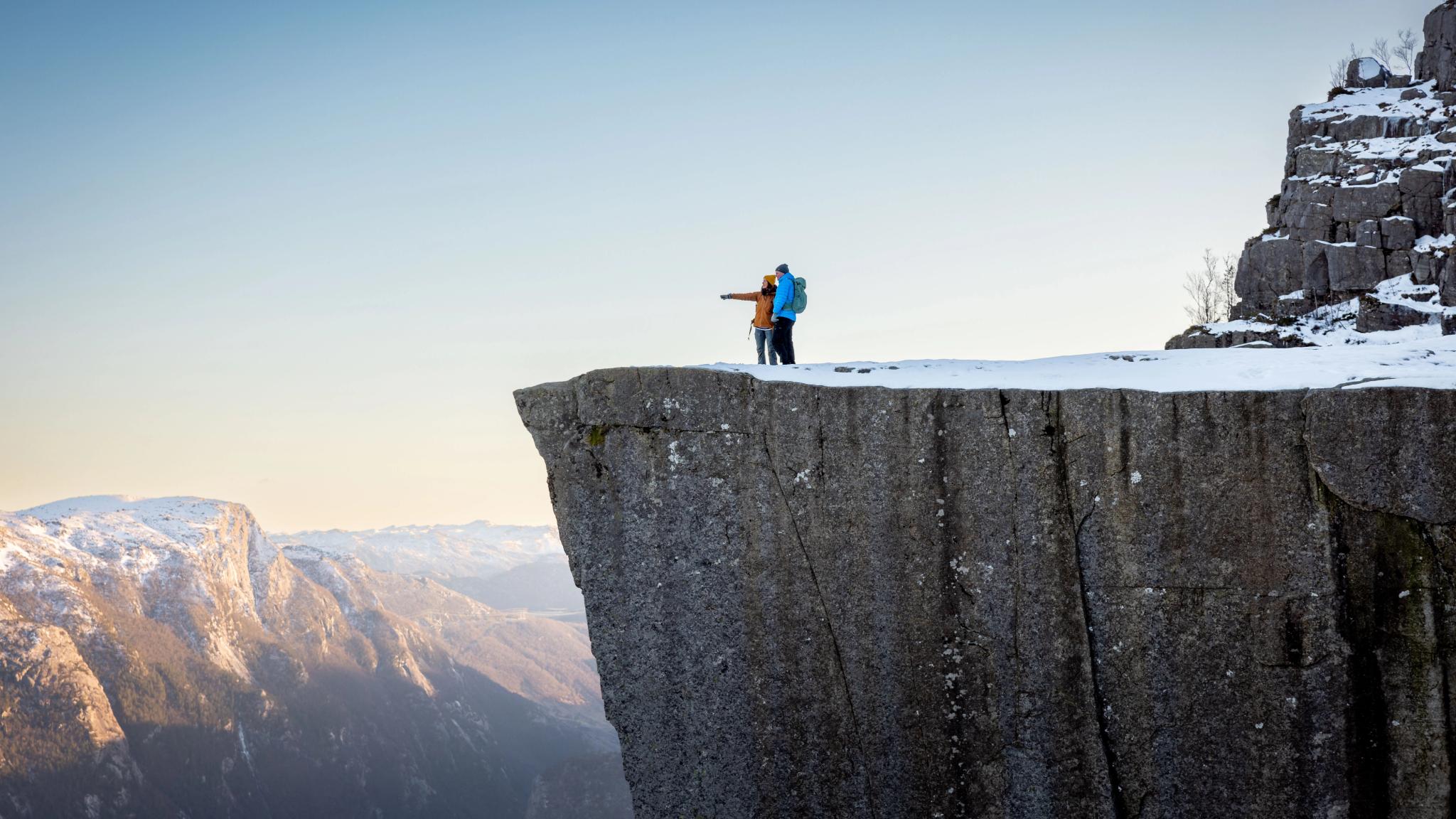 Two people on the Pulpit Rock, Preikestolen, Norway