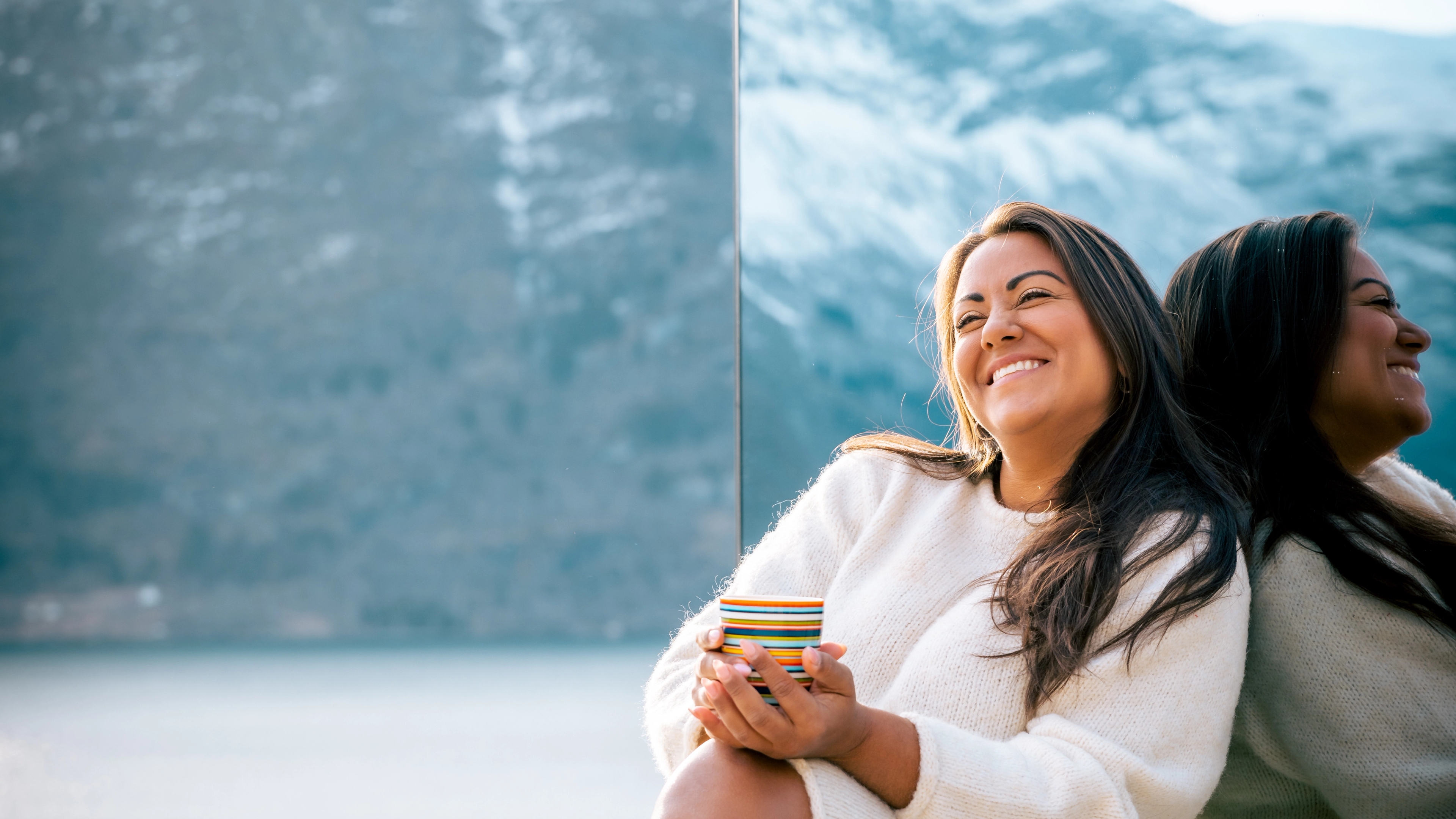 Woman outside of the The Fjord Mirror - Panoramic view of Lustrafjorden