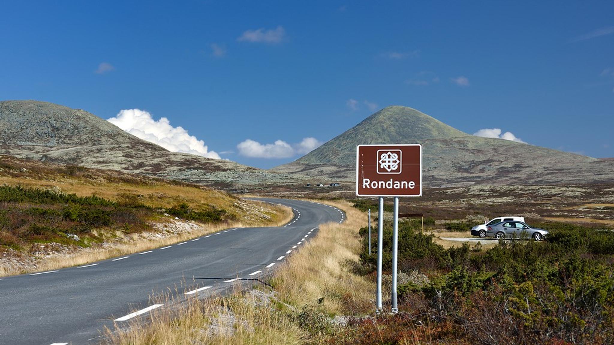 A road near a massive mountain.