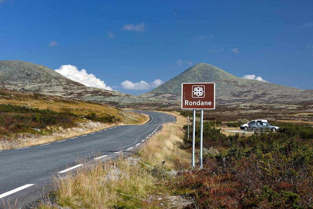 A road near a massive mountain.