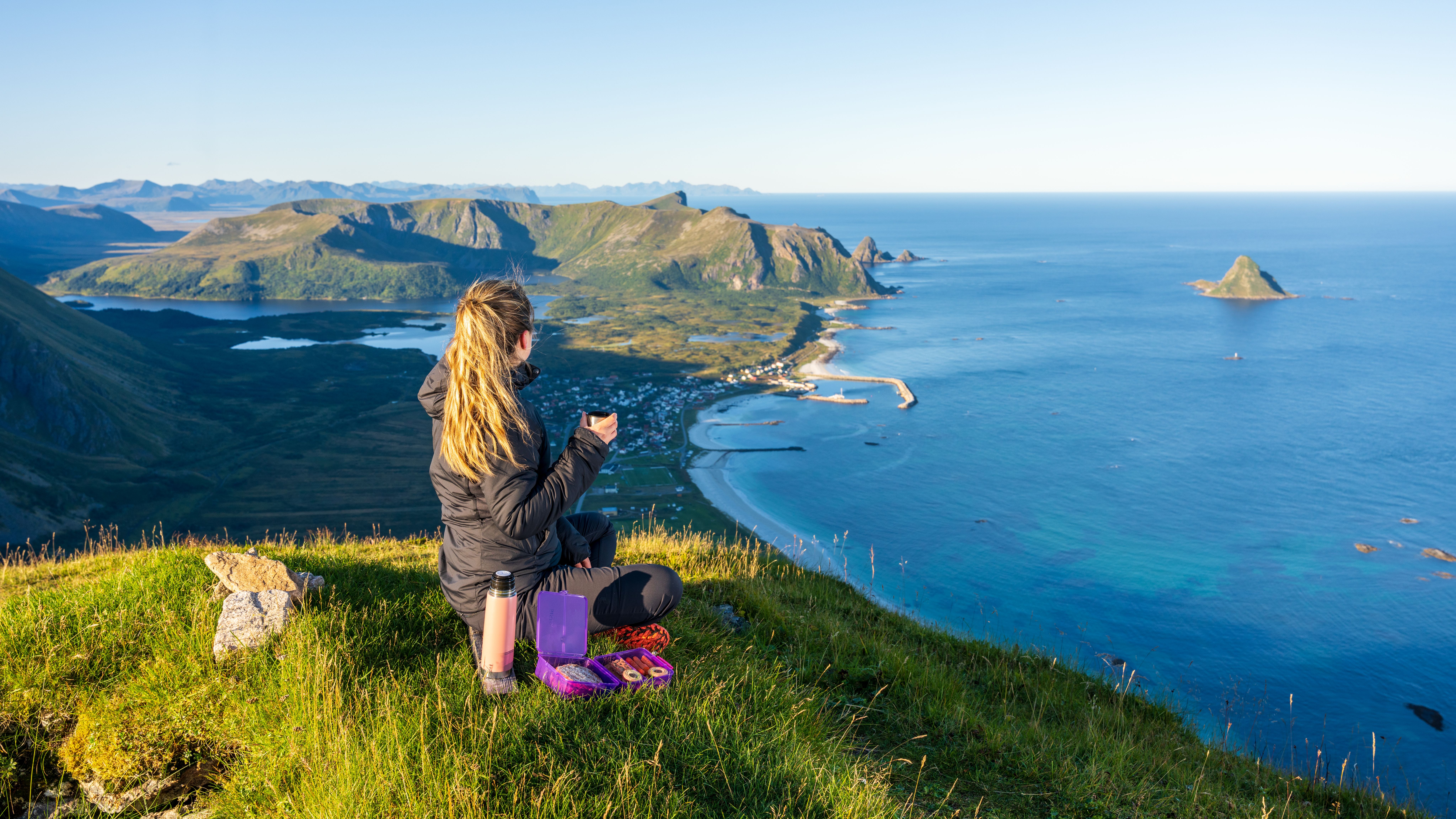 Girl hiking at Mount Røyken - view of Bleik beach
