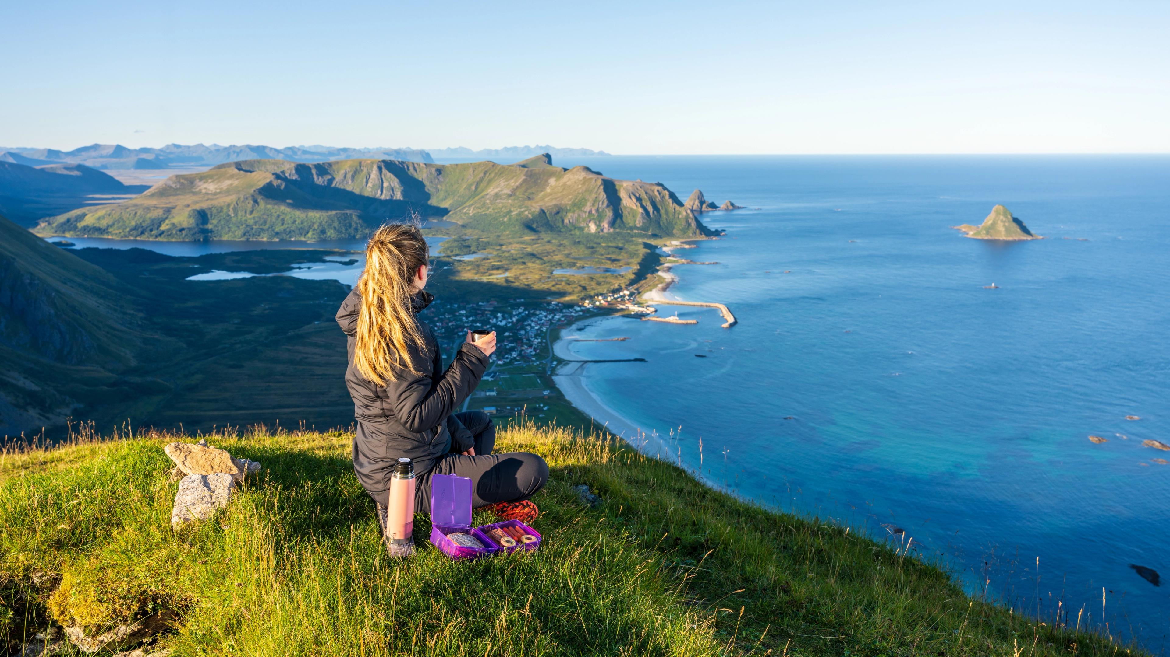 Girl hiking at Mount Røyken - view of Bleik beach