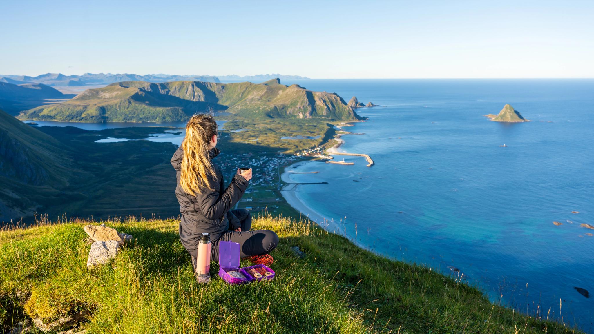 Girl hiking at Mount Røyken - view of Bleik beach