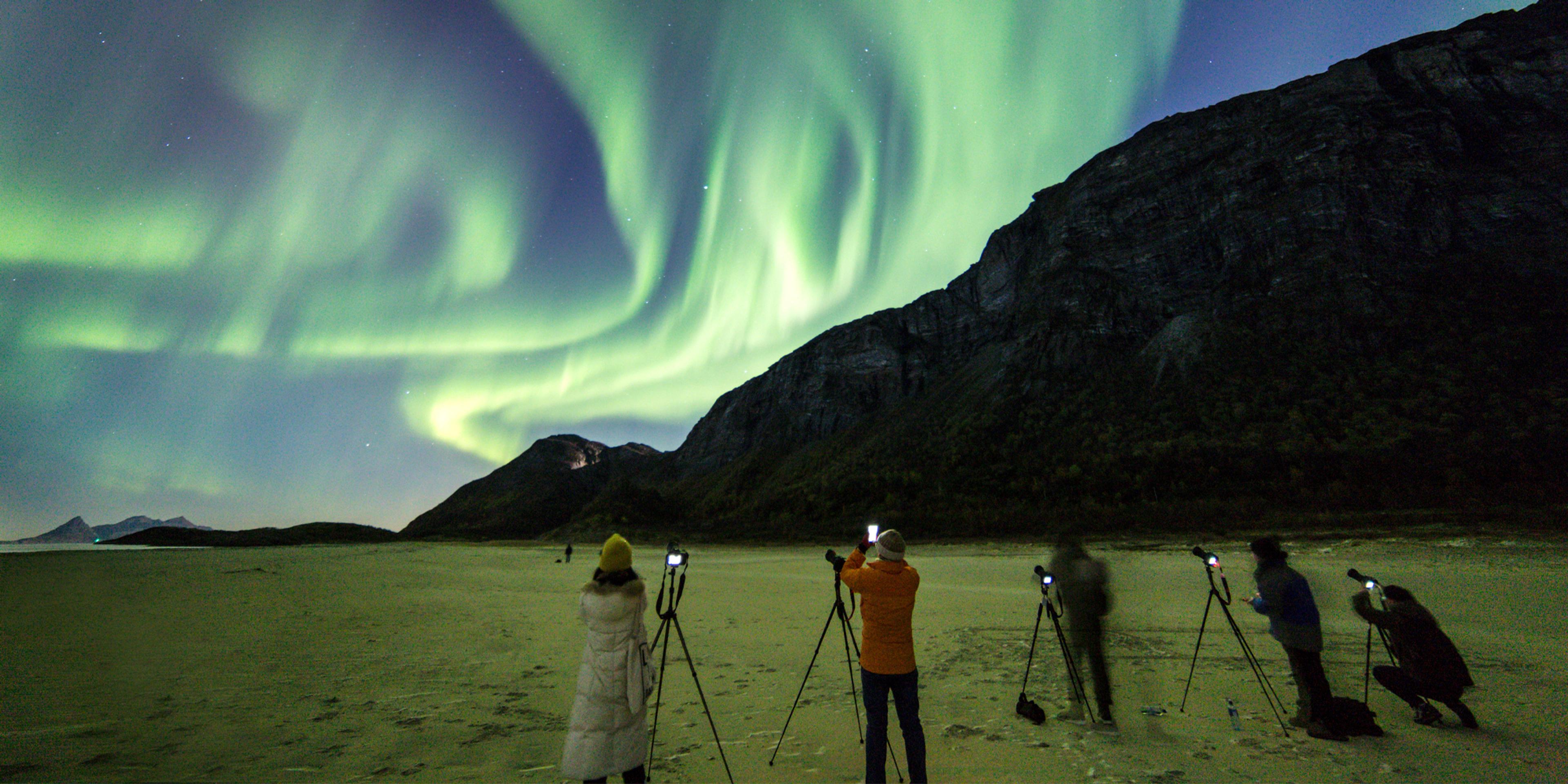 People learning how to photograph the northern lights in Gildeskål, Northern Norway